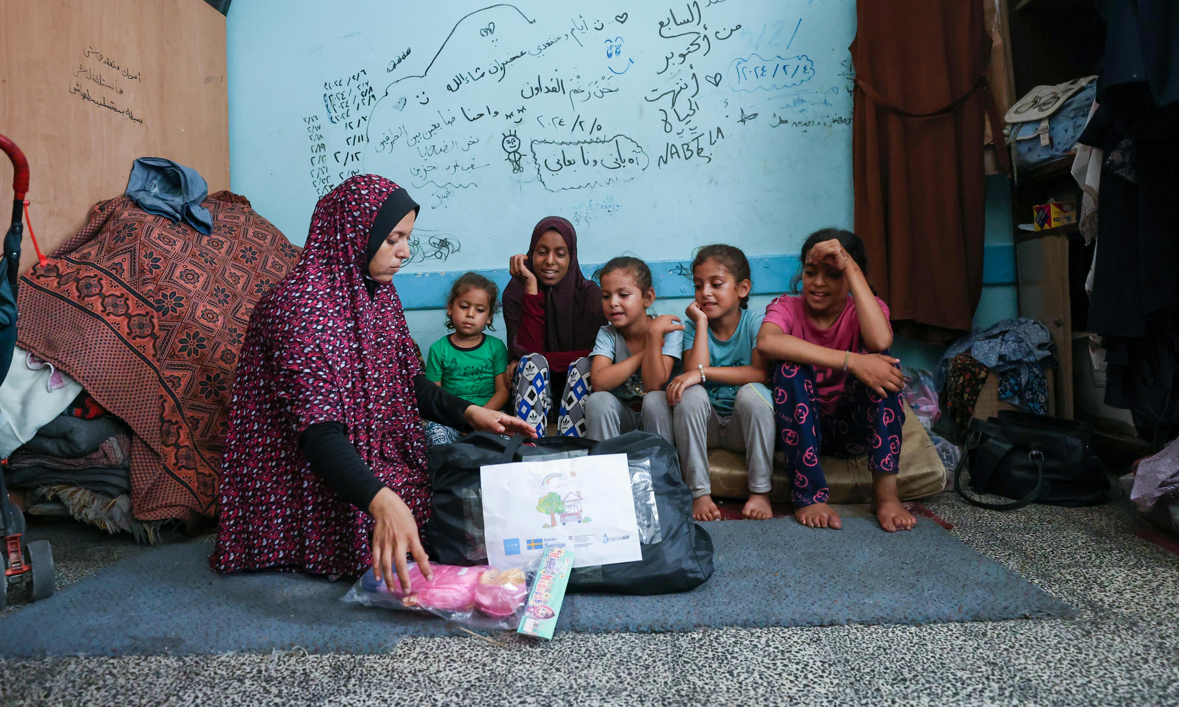 Children receiving UNICEF-supported Psychosocial Support Kits (PSS kits) in northern Gaza Strip,