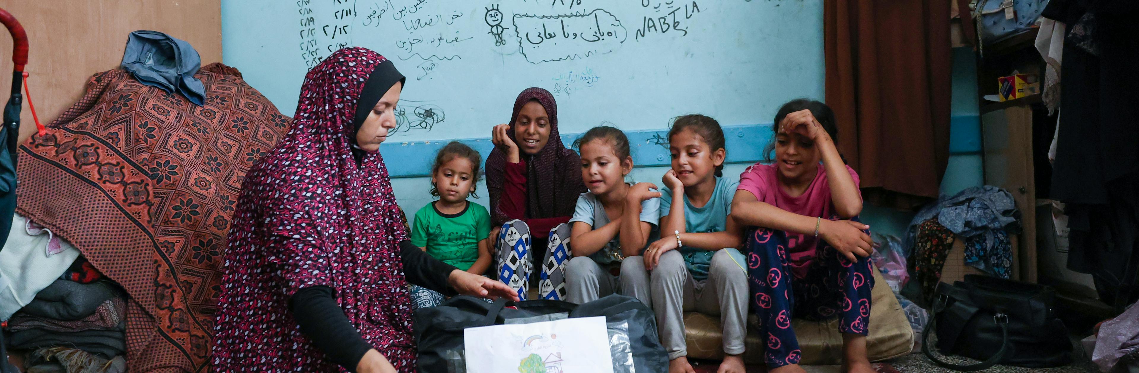 Children receiving UNICEF-supported Psychosocial Support Kits (PSS kits) in northern Gaza Strip,