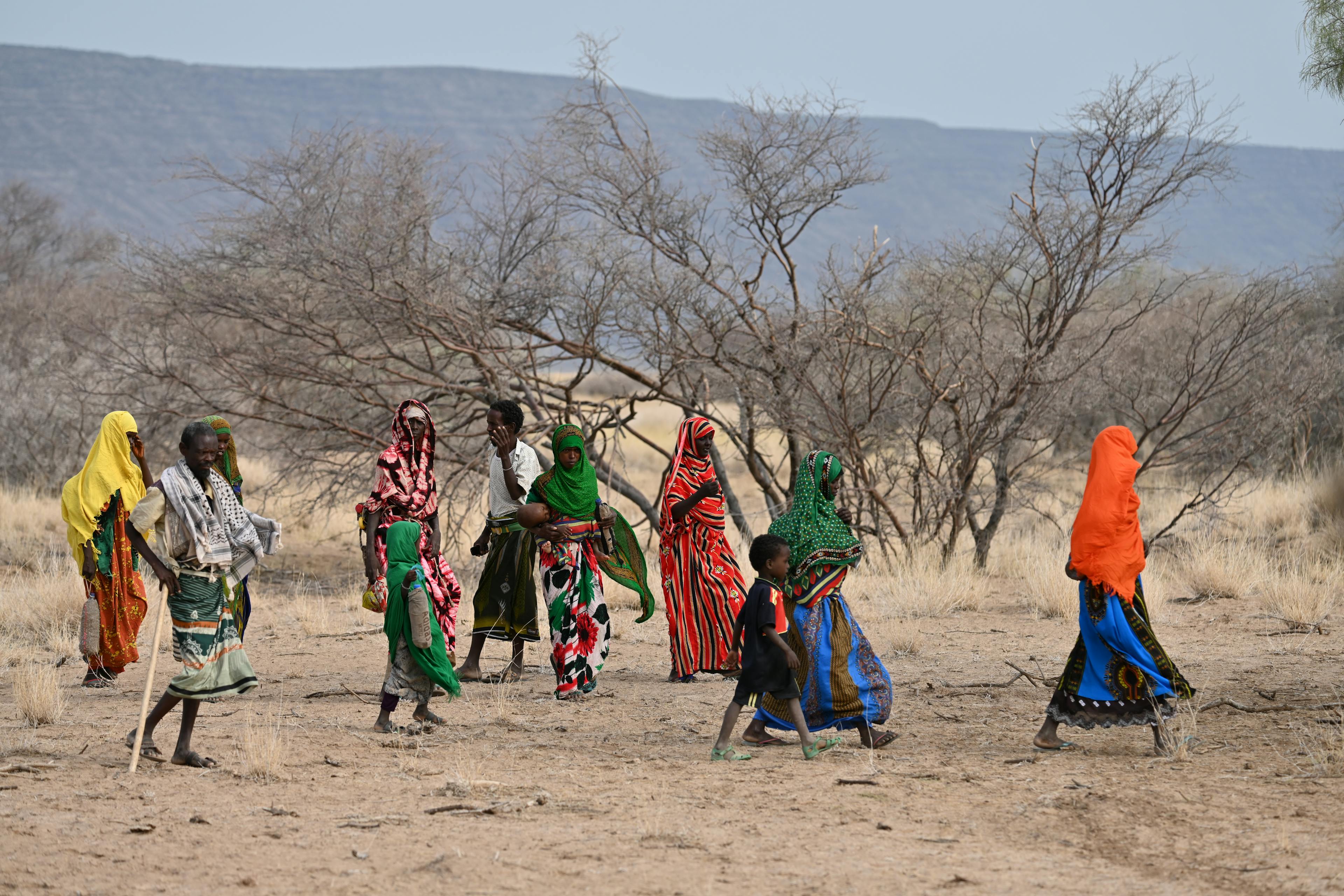 Woman and children walking for hours to receive health nutrition including immunization services through integrated mobile health and nutrition teams, in one of the weredas in Elidar district, in northeastern Ethiopia.