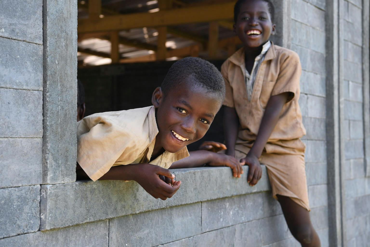 Children are very happy with the construction of their new classes made of plastic bricks, in Sakassou, a village in the center of Côte d'Ivoire.