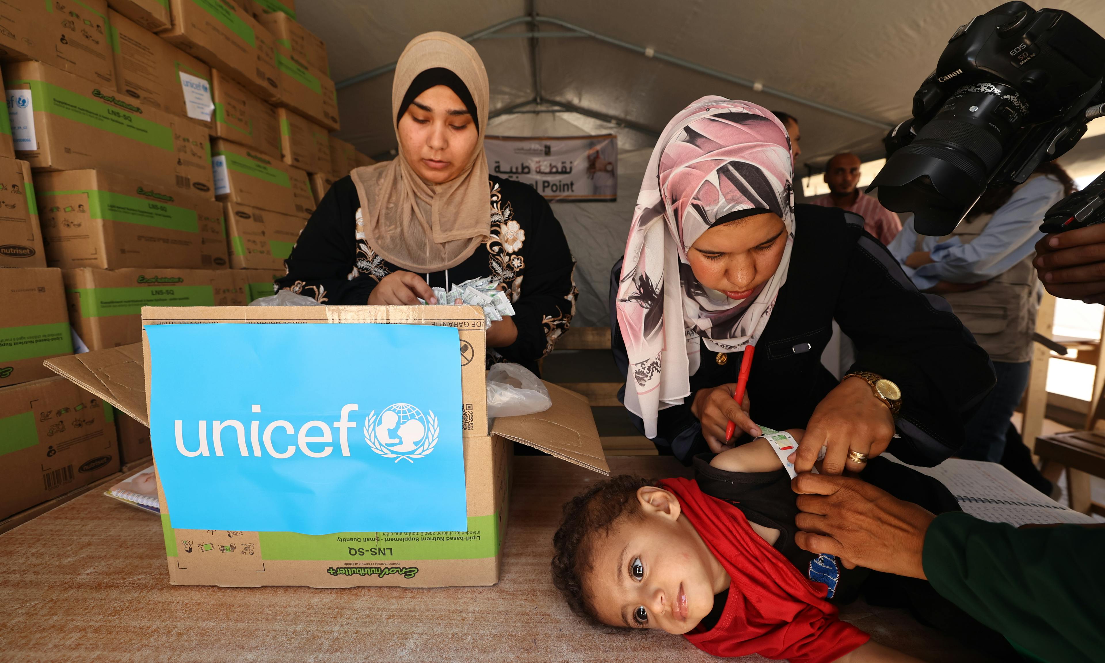 Vulnerable children receive nutrition support at a UNICEF-supported malnutrition screening and treatment point in Khan Yunis, southern Gaza Strip 

