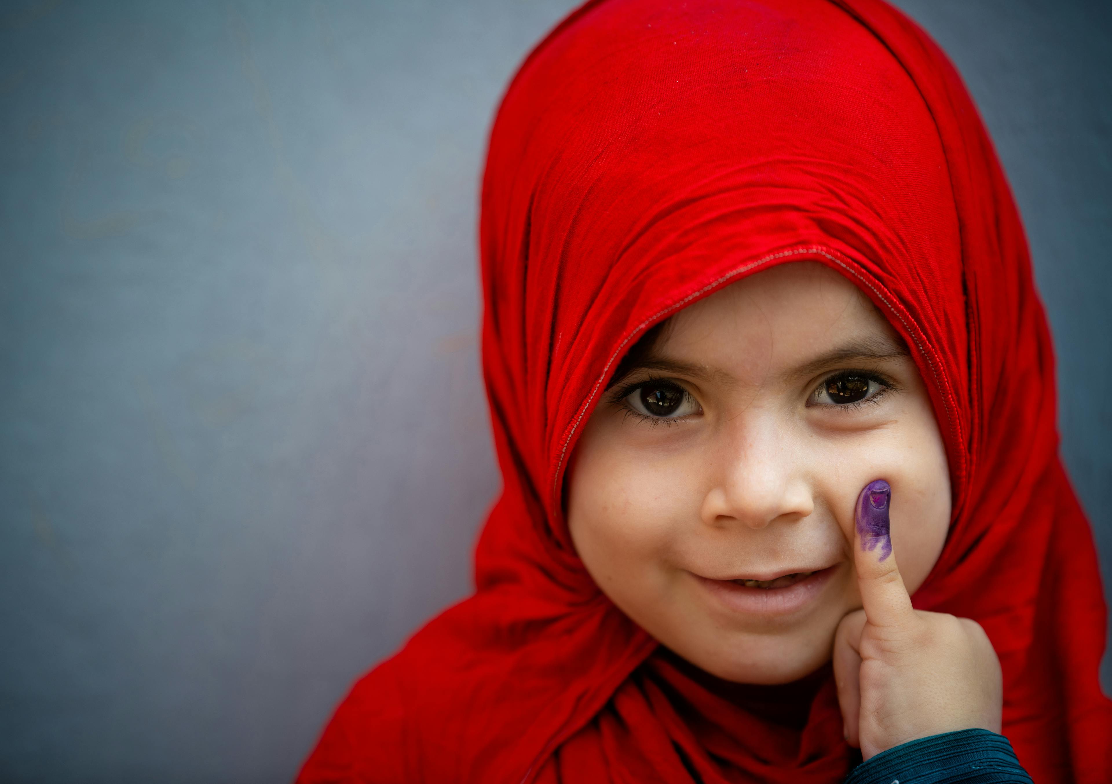 On 22 September 2020, a young girl shows her marked finger after receiving the polio vaccine in Rawalpindi. The country’s first national polio vaccination campaign in September 2020 – after a six-month pause due to COVID-19 – reached over 39 million children under five years of age. More than 260,000 trained frontline workers went door to door and, in the context of COVID-19, were equipped with personal protective gear to ensure the safety of children, caregivers and the workers themselves.