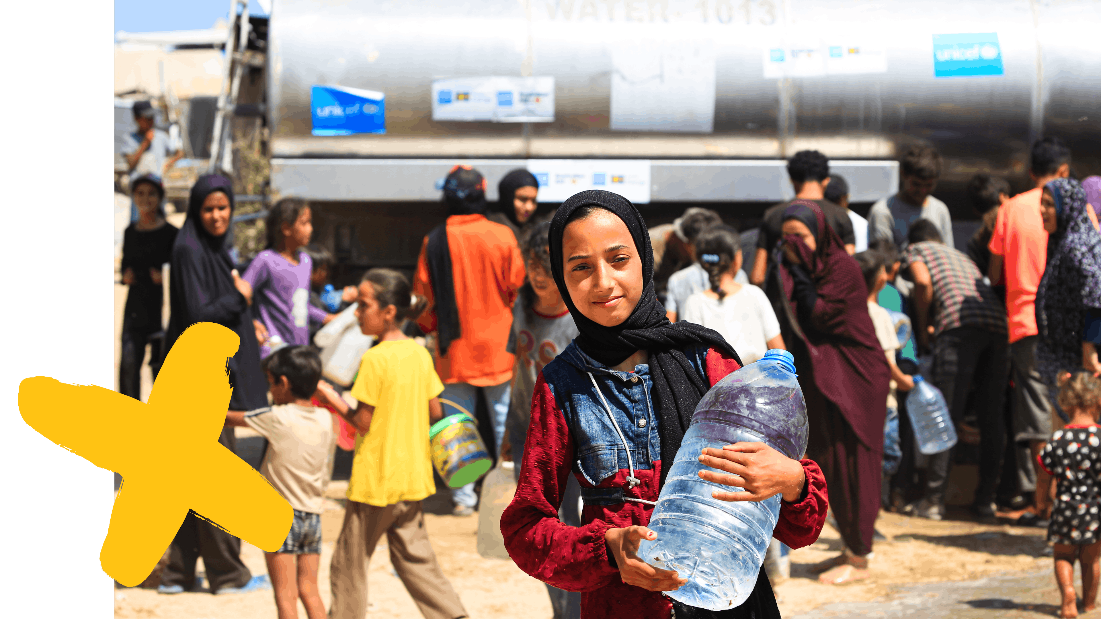 Malak, 14-years-old holding a bottle of water after she filled from a UNICEF-supported water tank in Deir al-Balah, in the Gaza Strip, thanks to the government of Australia and Sweden.