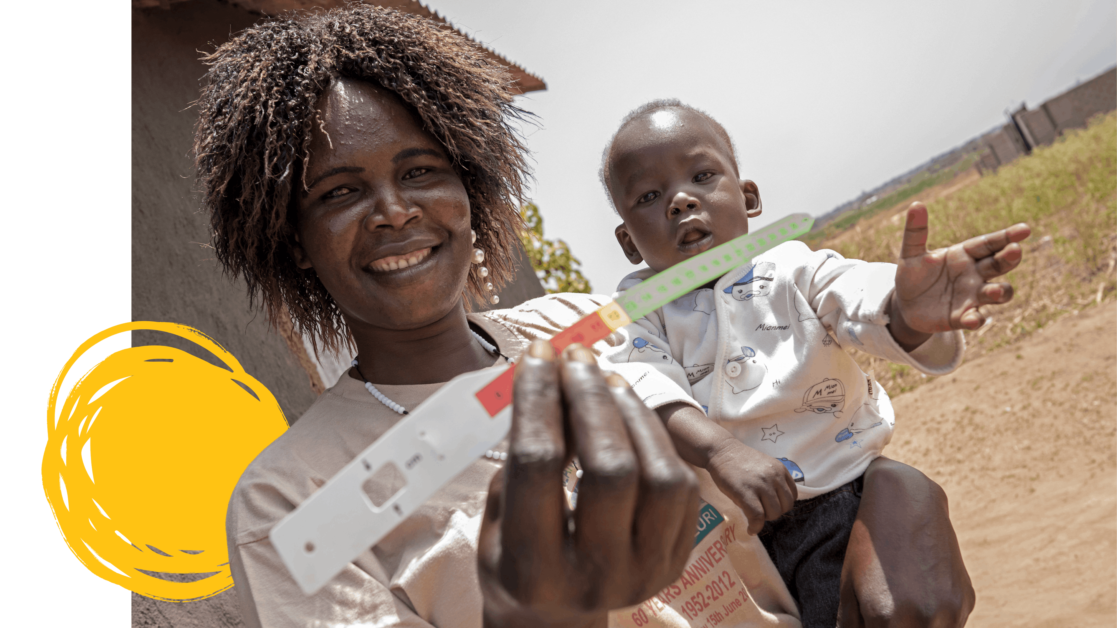 On 9 February 2022, Terresa Ketale is photographed with her 7 month old son, Samuel Sarahphino, having just attended a workshop on malnutrition and received a mid-upper arm circumference (MUAC) measuring band in Luri in Juba, South Sudan. 