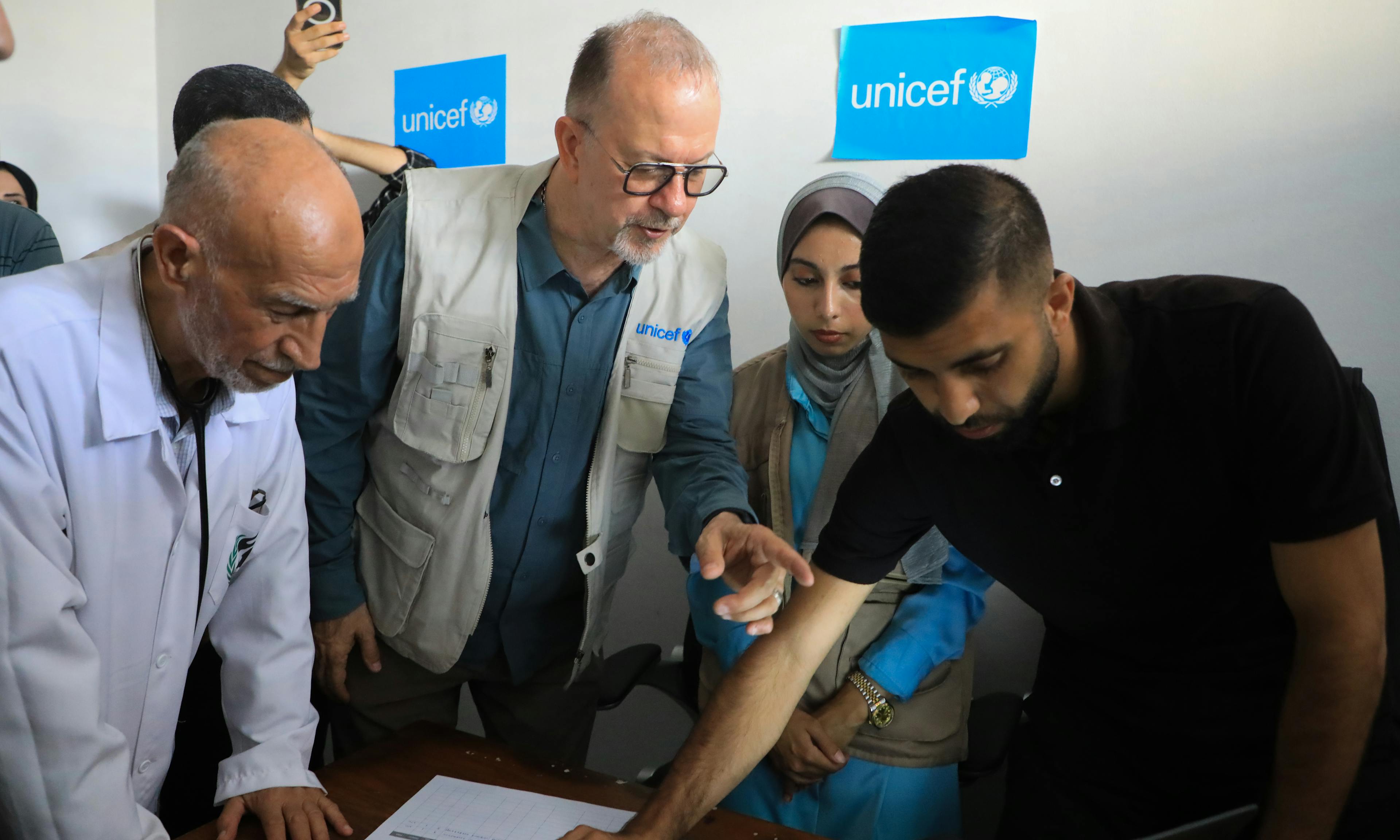 Ted Chaiban, UNICEF Executive Director for Humanitarian Action and Supply Operations, speaks with members of the medical team at the malnutrition treatment point of the Friends of the Patient Society Hospital in Gaza City on 29 July 2025.