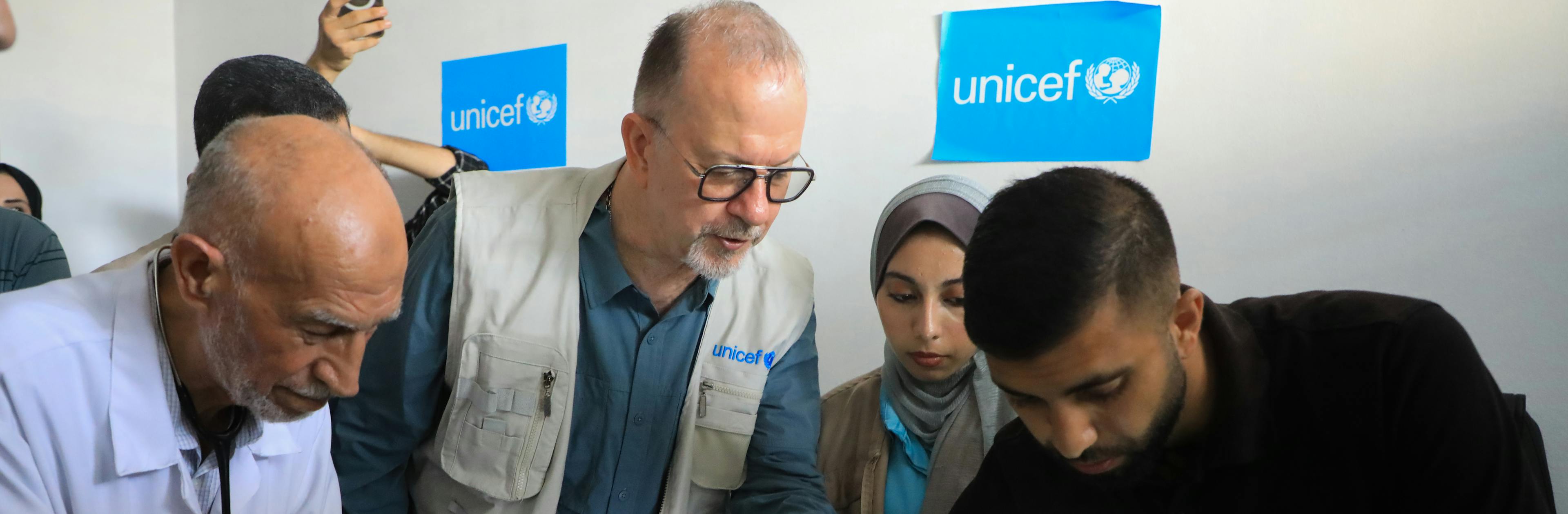 Ted Chaiban, UNICEF Executive Director for Humanitarian Action and Supply Operations, speaks with members of the medical team at the malnutrition treatment point of the Friends of the Patient Society Hospital in Gaza City on 29 July 2025.