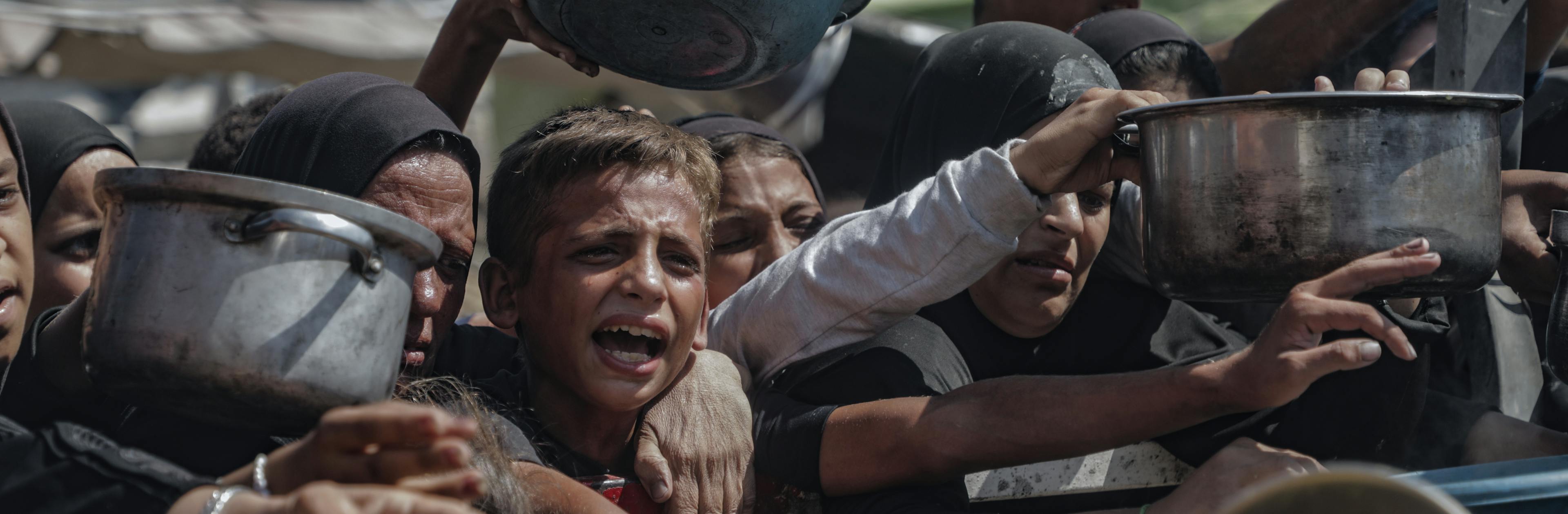 Children in Gaza, July 2025, trying to get food from aid distribution centers.