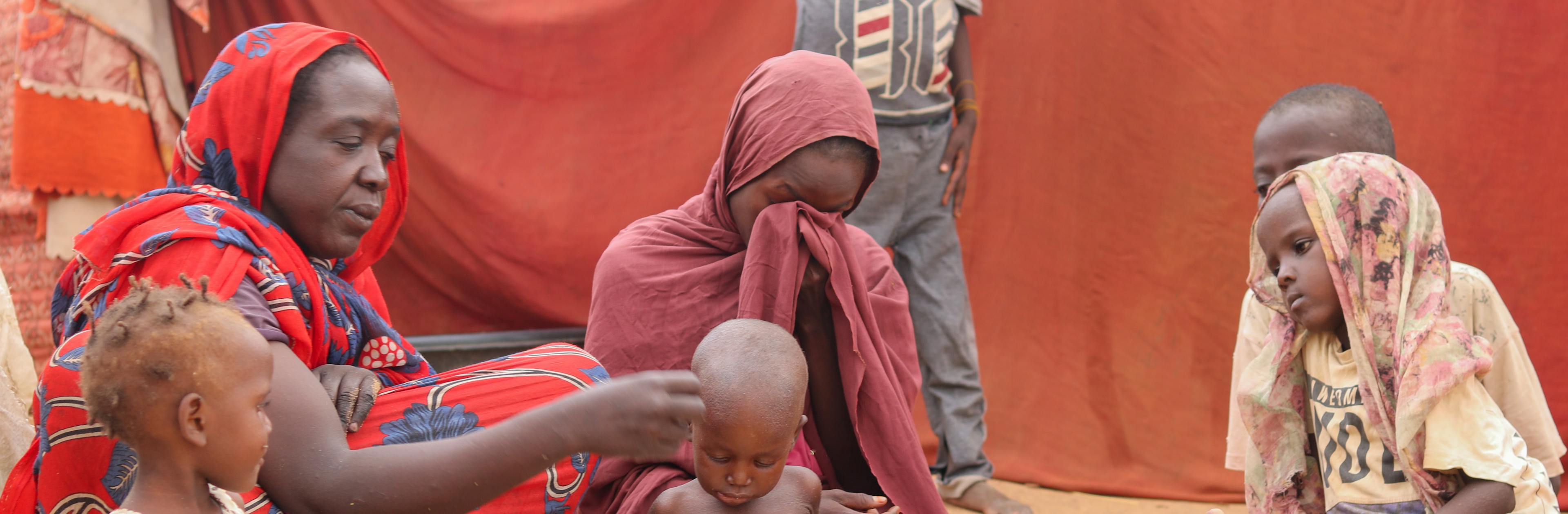 On 14 August, mothers with their children in a gathering site in Al Fasher, North Darfur.