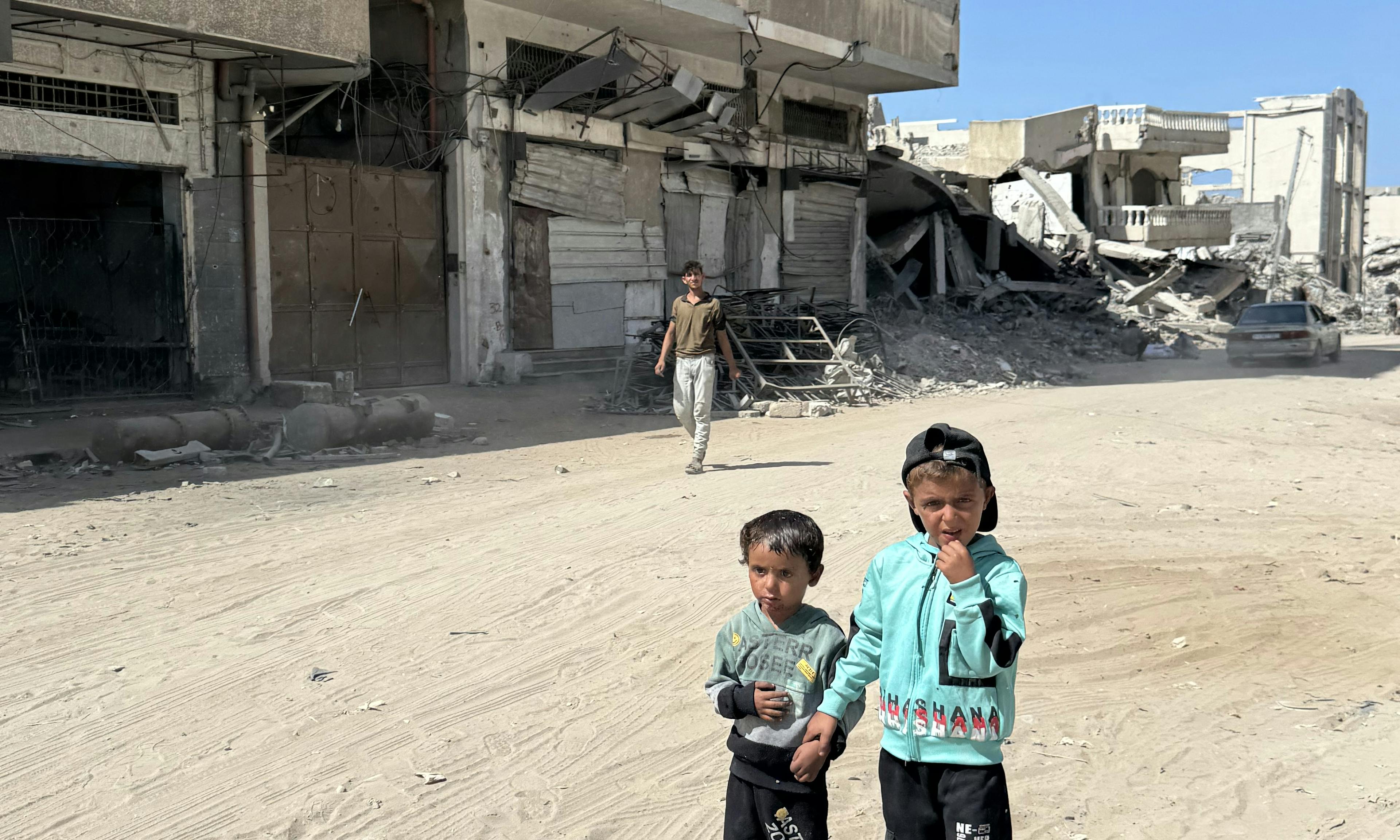Children stand in the streets of Gaza City in the Gaza Strip on 2 October 2025.