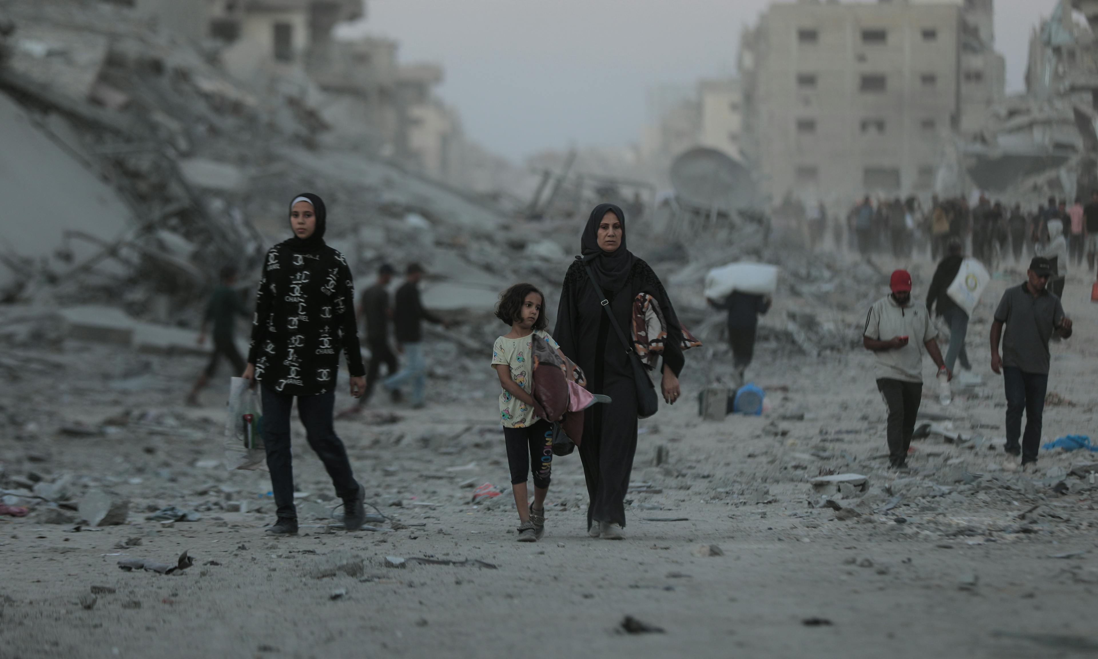 On 10 October 2025, thousands of Palestinian families are moving along the coastal road back to northern Gaza, amid the extreme devastation of infrastructure