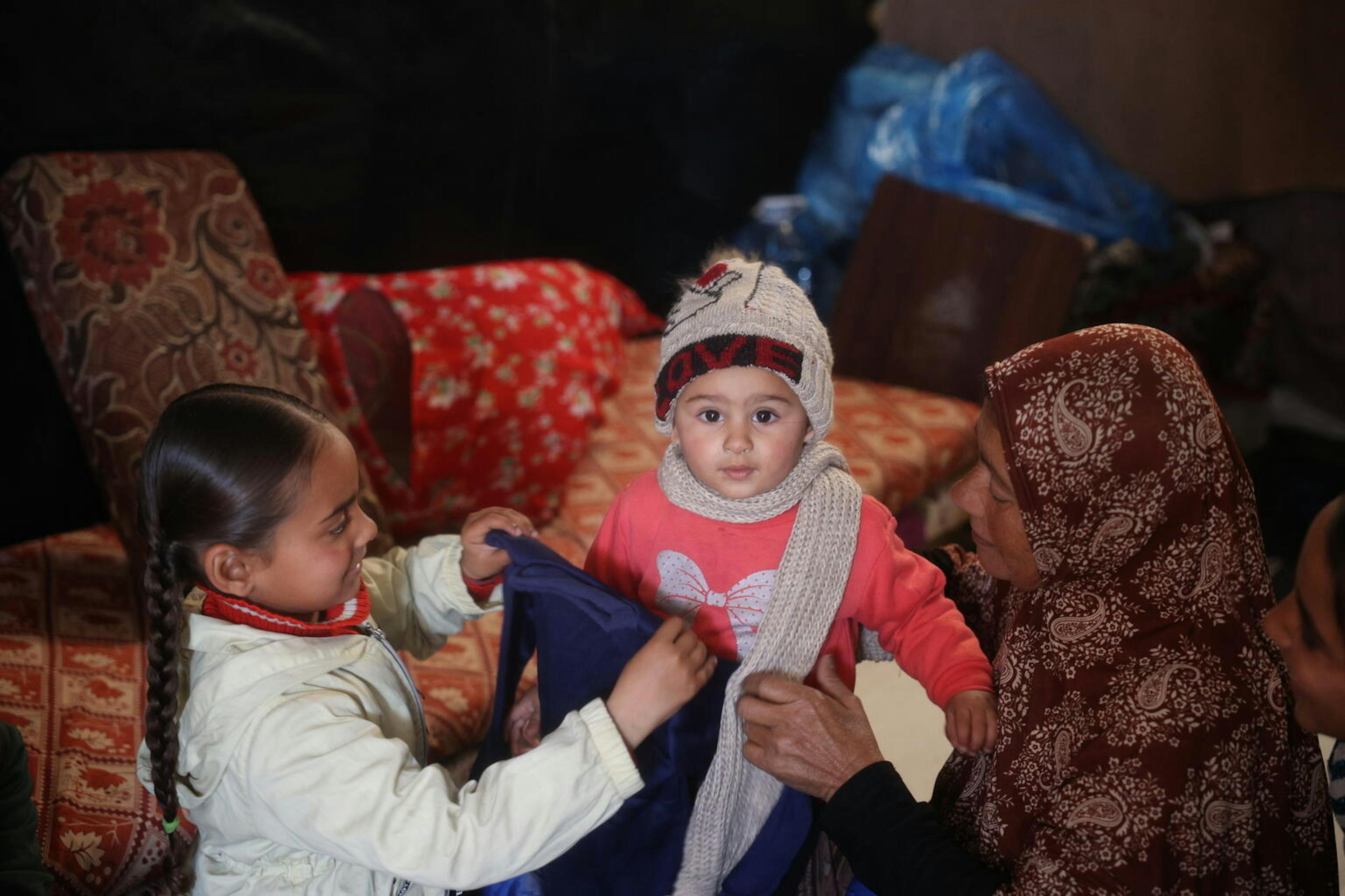A child in Gaza receives warm winter clothes