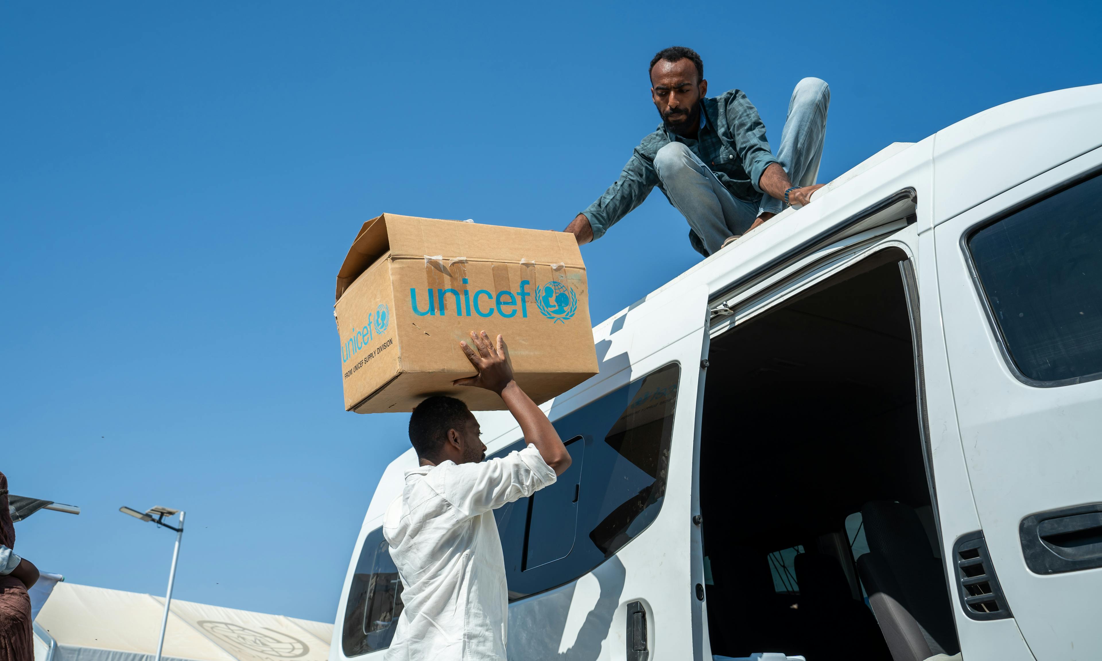 Aid being unloaded off a van in Sudan