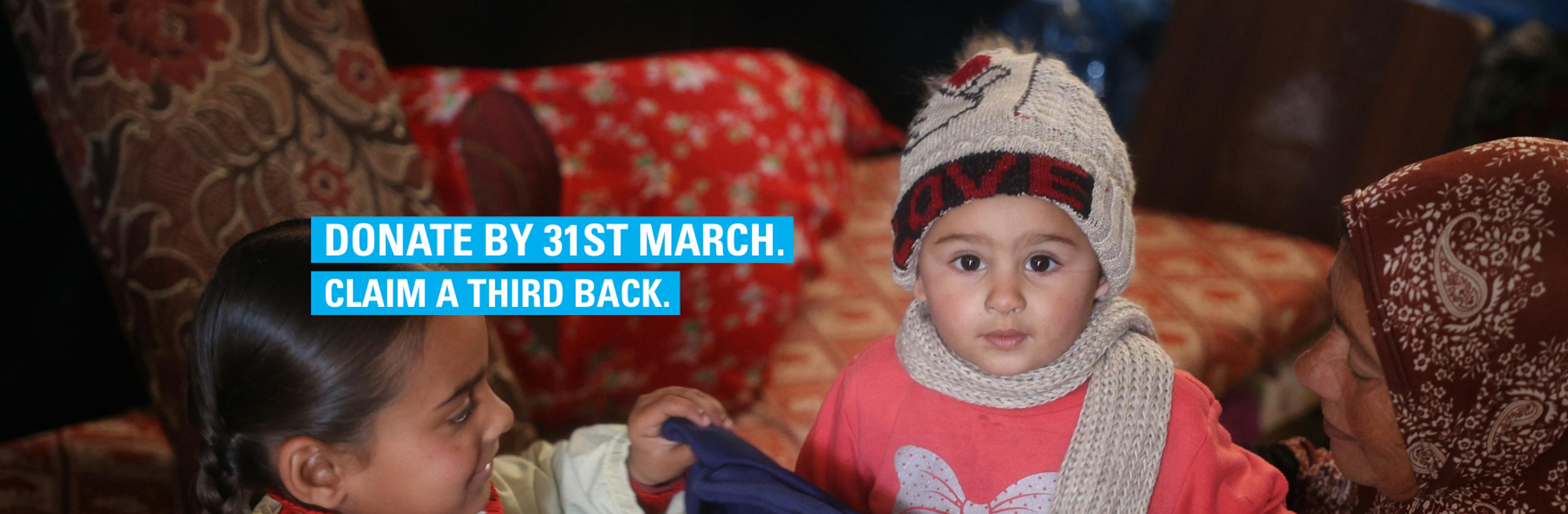 A child in Gaza receives warm winter clothes