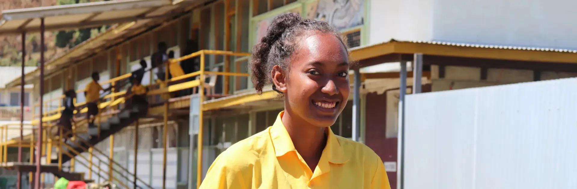 Student Anna Rini stands outside her school, Honiara Senior High School, in the Solomon Islands