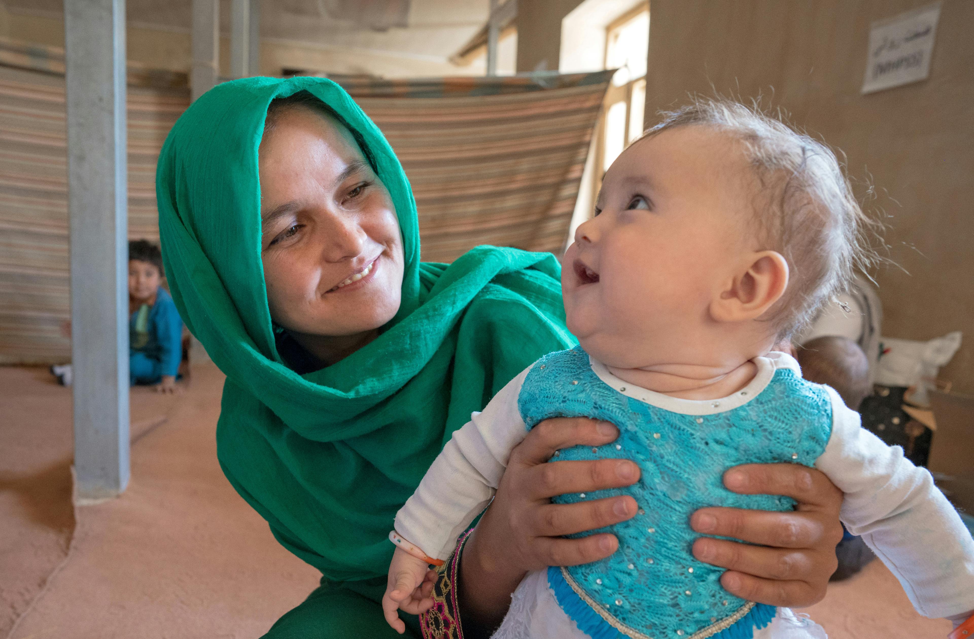 Emergency- A mother and child attend the UNICEF-supported mobile health and nutrition clinic in Safeedi-Mish village in Nili District in Daikundi Province, central Afghanistan.
