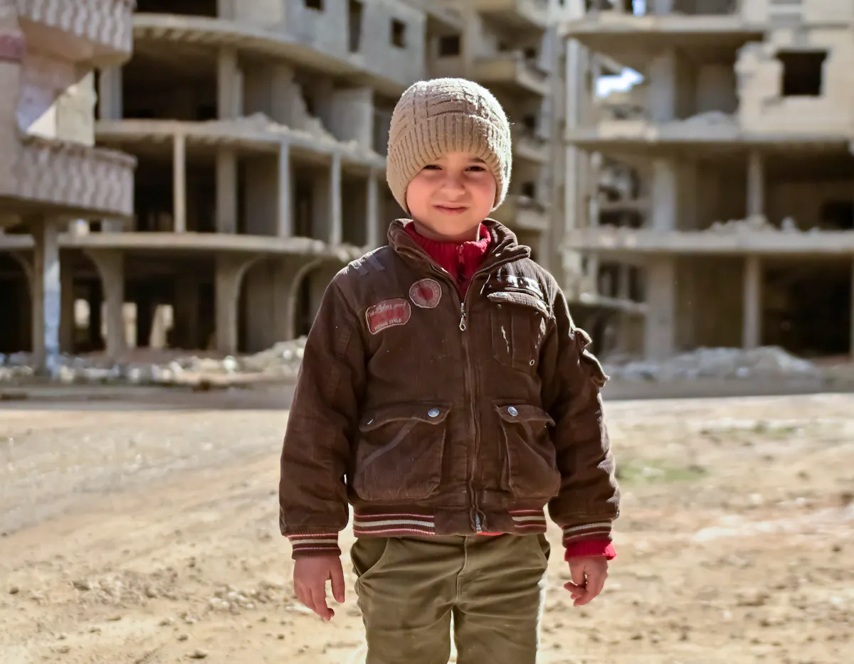 Nasser, 5, stands near his home in Tadamon neighbourhood, where UNICEF-supported rehabilitation of the sewage network is taking place.