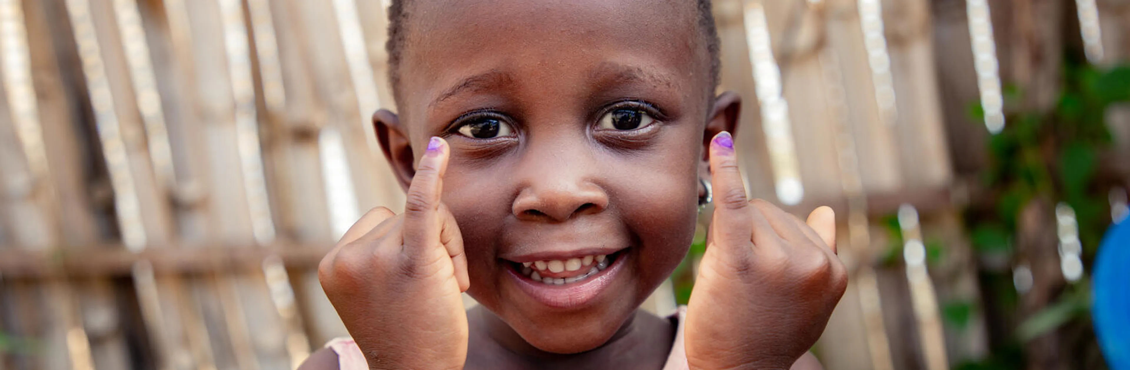 Davina, 4, shows her marked finger after receiving four drops of the polio vaccine in Kisangani, Tshopo Province, DR Congo, on 28 August 2025.