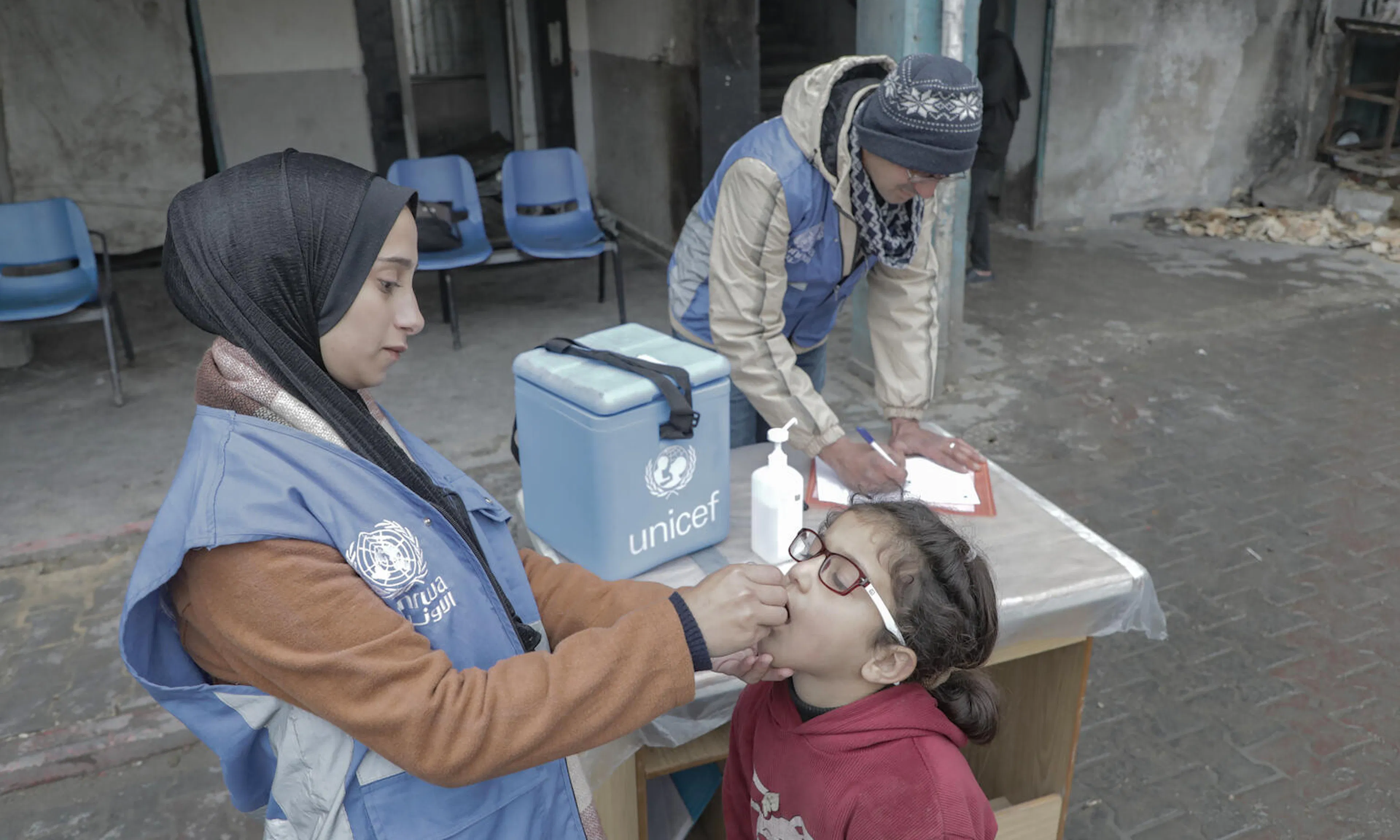 Children are receiving polio vaccines, at a school in Beach camp in Gaza city,  as part of the vaccination campaign that is expected to run for the coming days. 