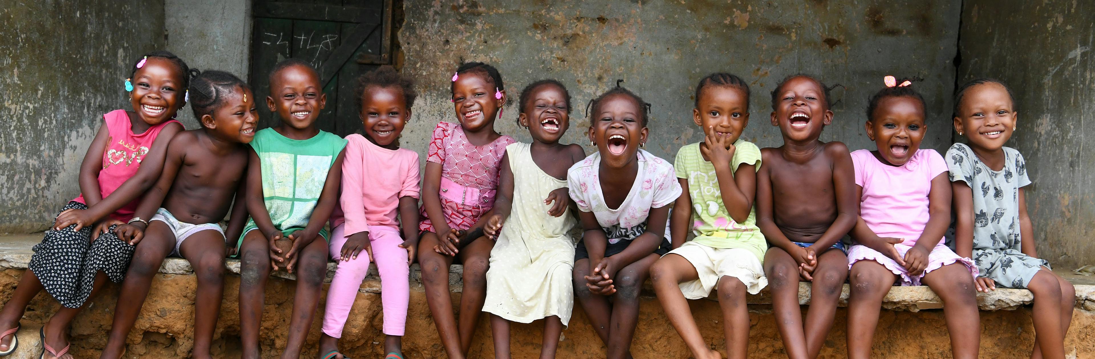 Contact Us- Children having fun in the streets of Adjamé, a suburban of Abidjan, the capital of Abidjan