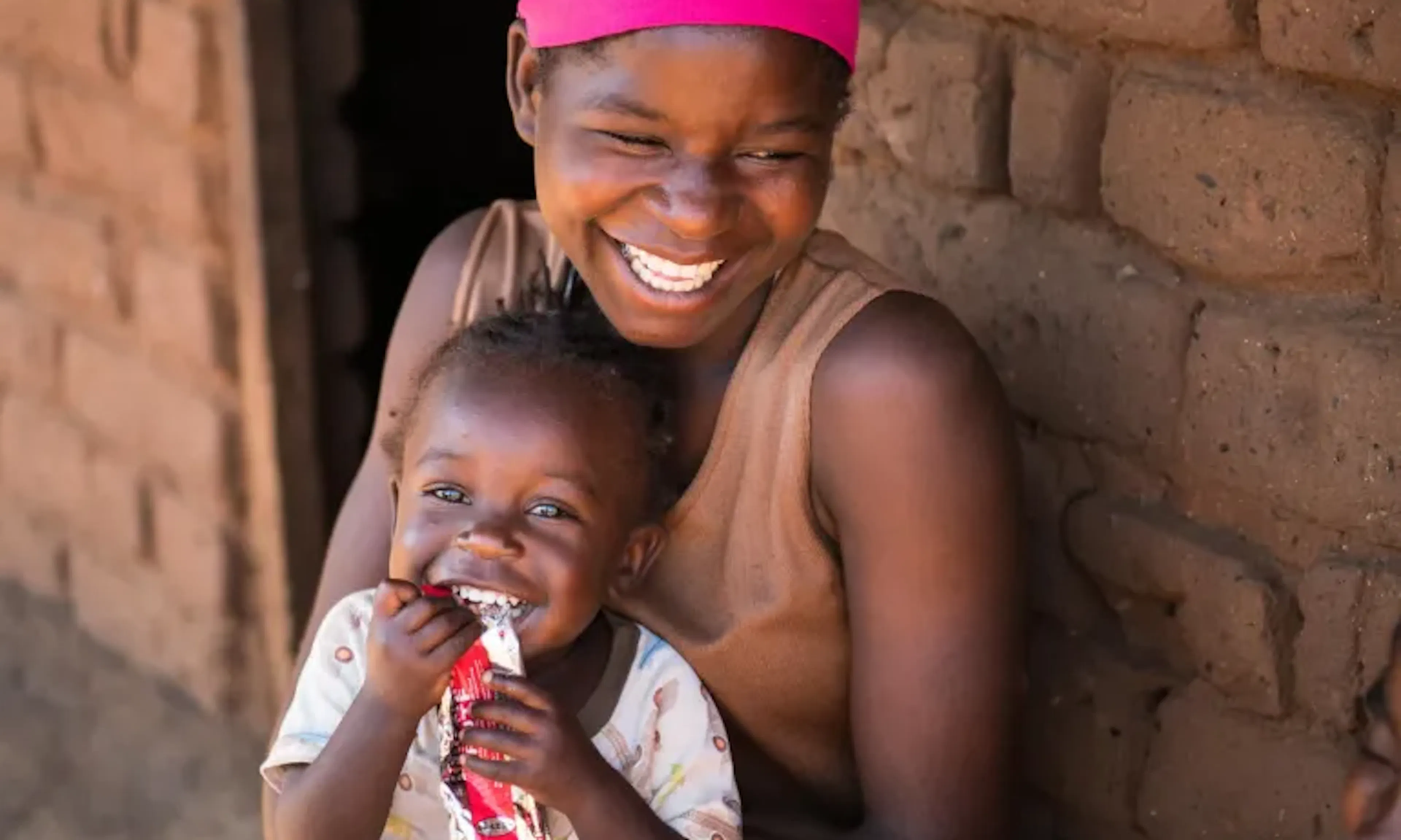 A child eats a RUTF sachet