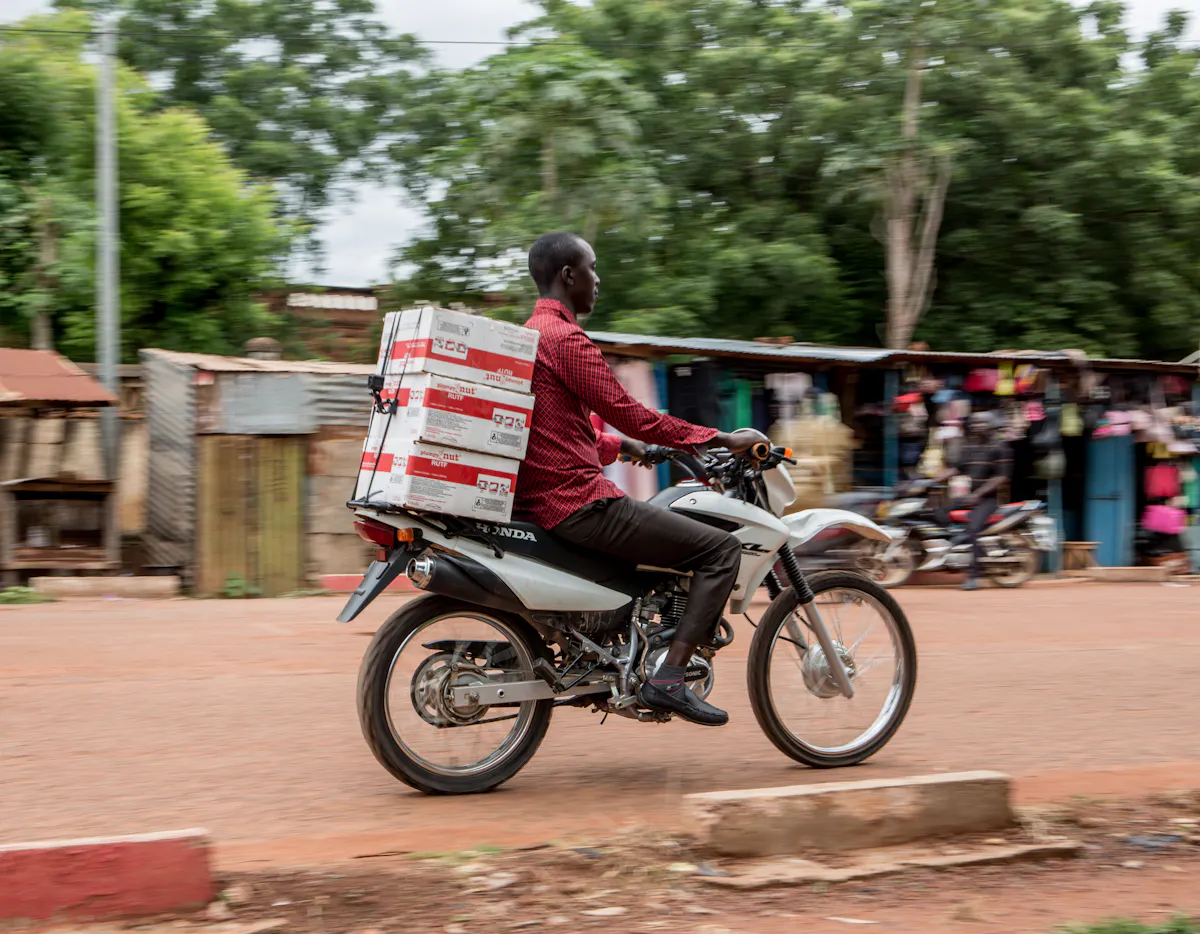 Man delivers RUTF on motorbike