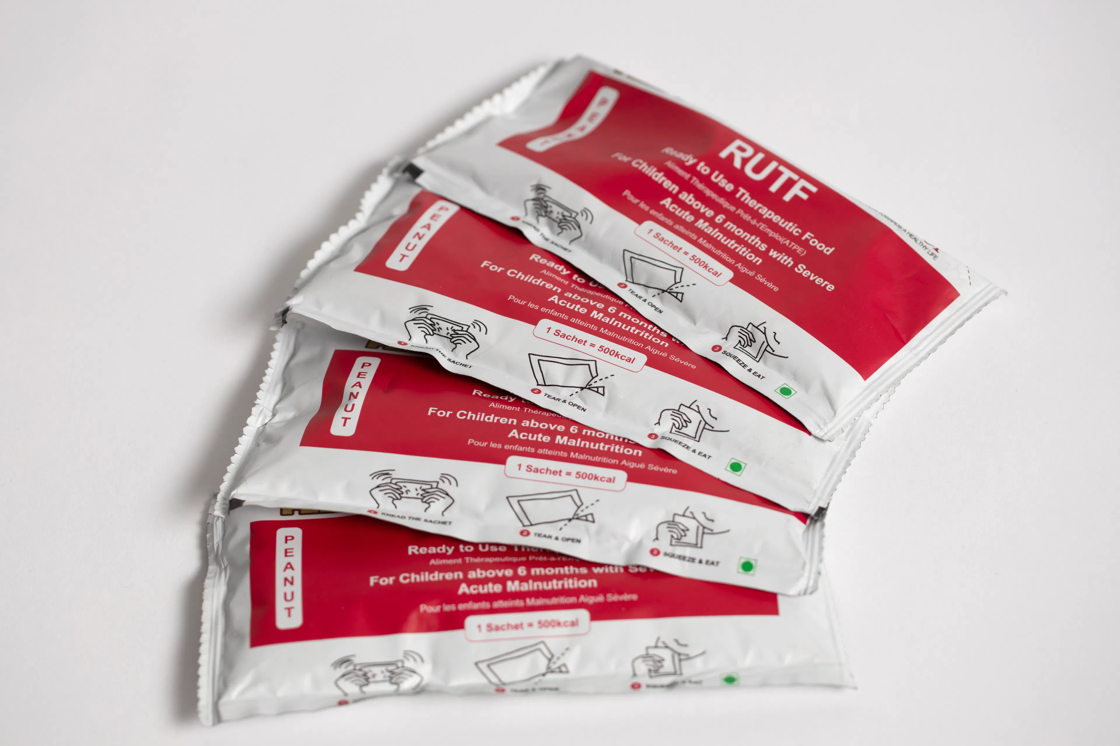 Four red RUTF sachets