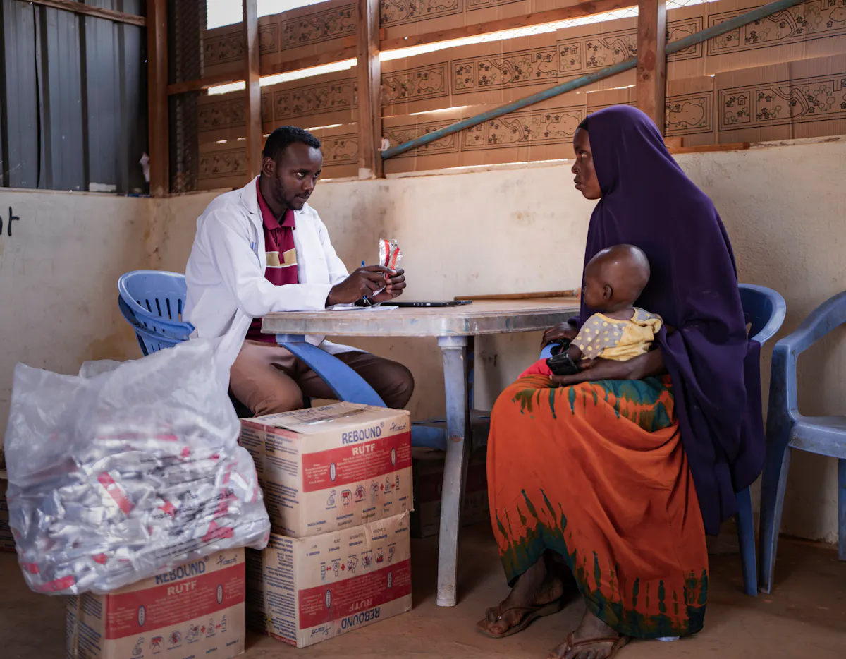 Mother receives RUTF from doctor for her child