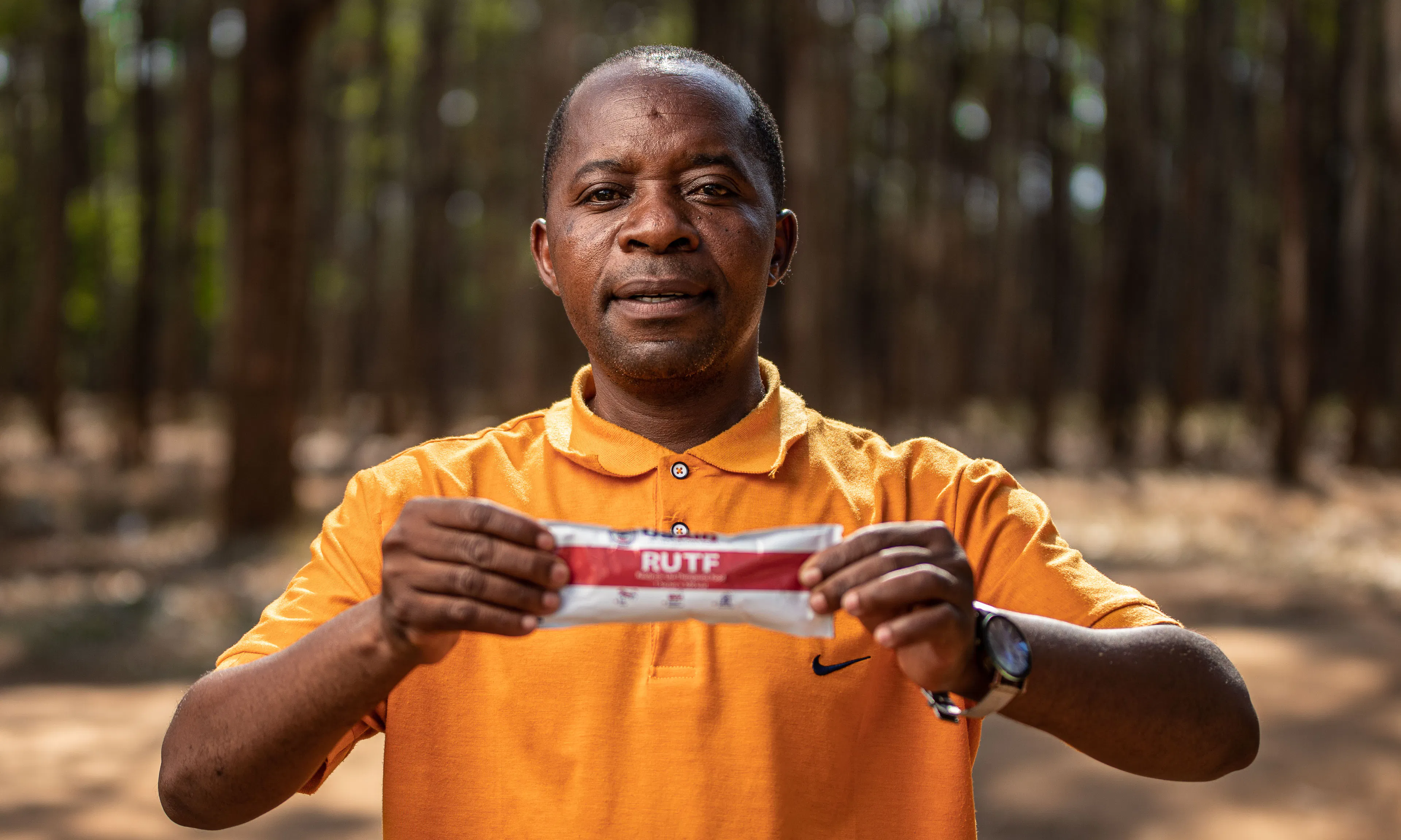 Man holding ready to use therapeutic food