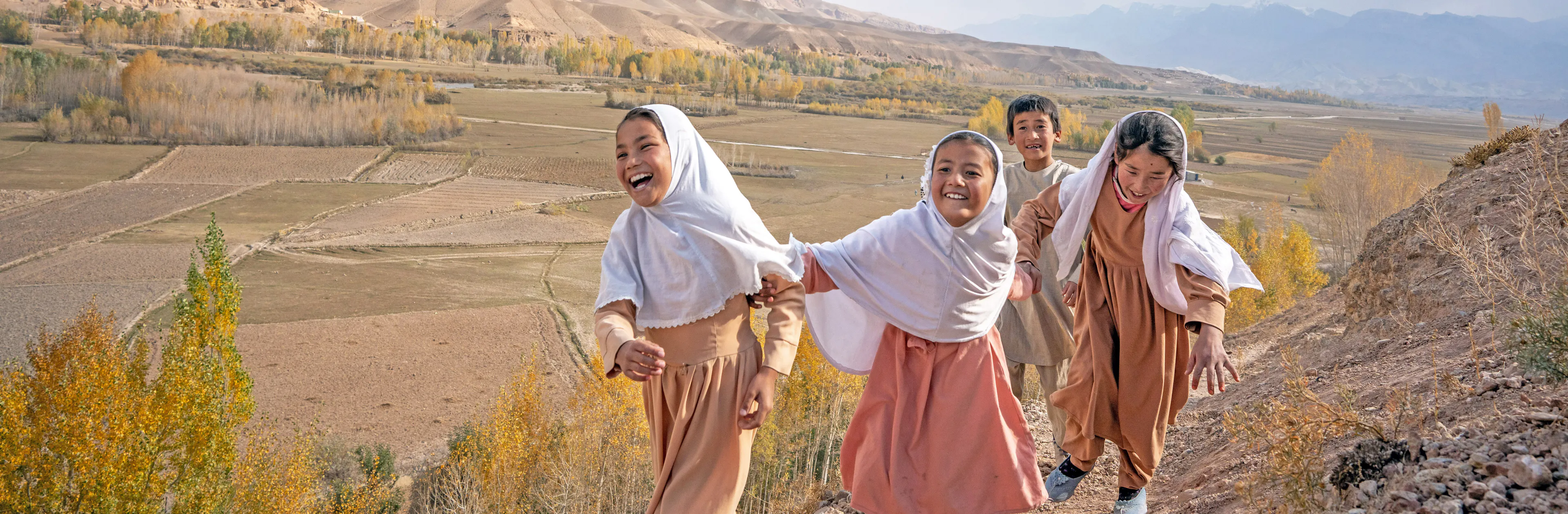 On the 22nd October 2024, children walk to the UNICEF-supported Community-Based Education centre in Larasi village in Bamiyan Province, central Afghanistan.
