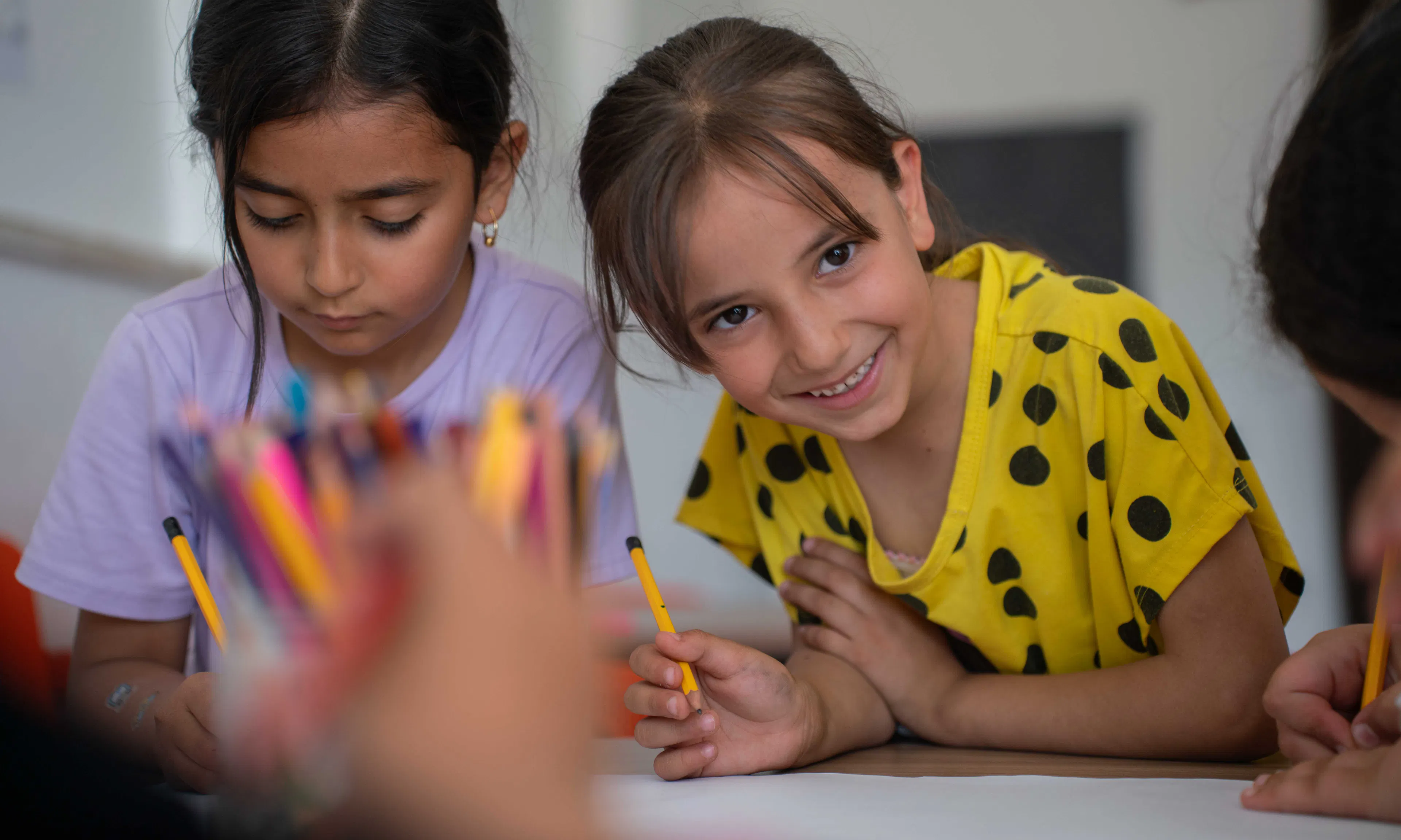 Jana (in Yellow) and other children in Qaryut  village near Jenin in northern West Bank participate in a UNICEF- supported psychosocial and educational support project for children.