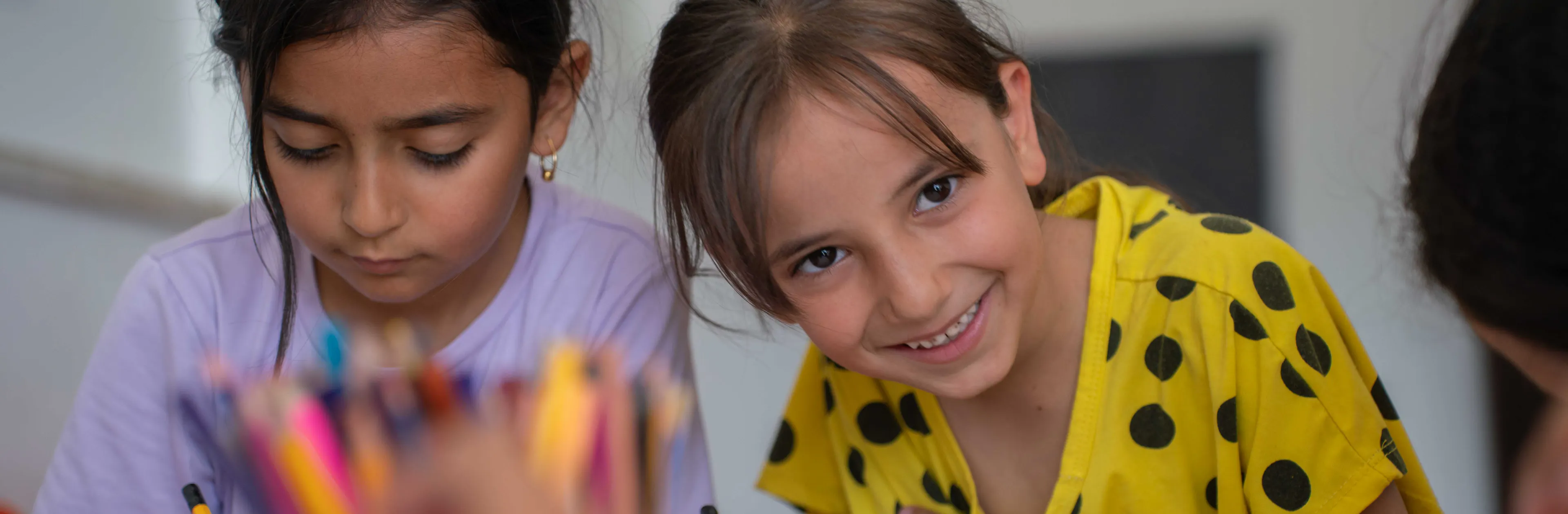 Jana (in Yellow) and other children in Qaryut village near Jenin in northern West Bank participate in a UNICEF- supported psychosocial and educational support project for children.