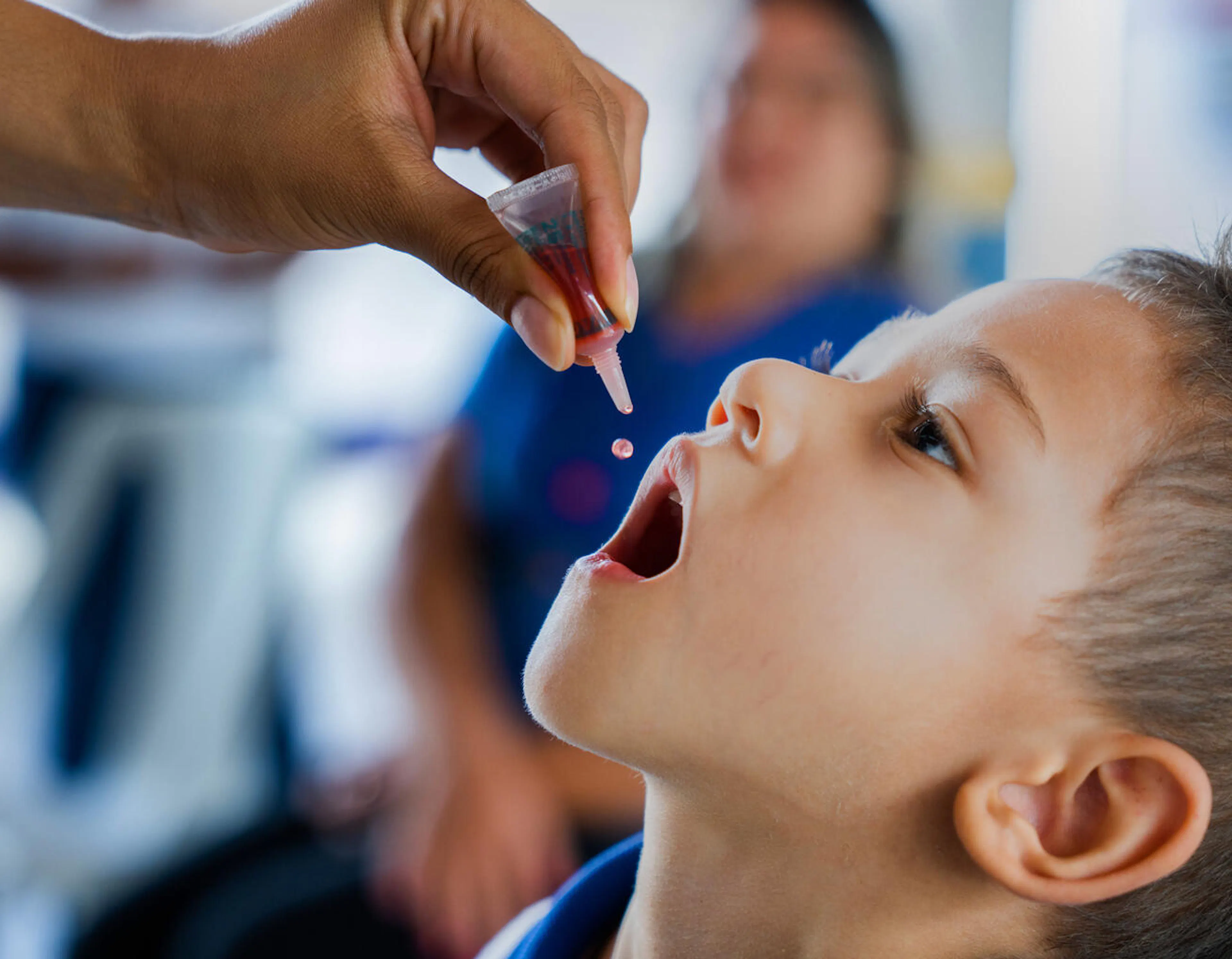 On 31 March 2023, a nurse administers the oral polio vaccine (OPV) vaccine to Samuel, 4, at the Early Childhood Education Centre Rocilda Germano Arruda in Baturité, Ceará state, Brazil.