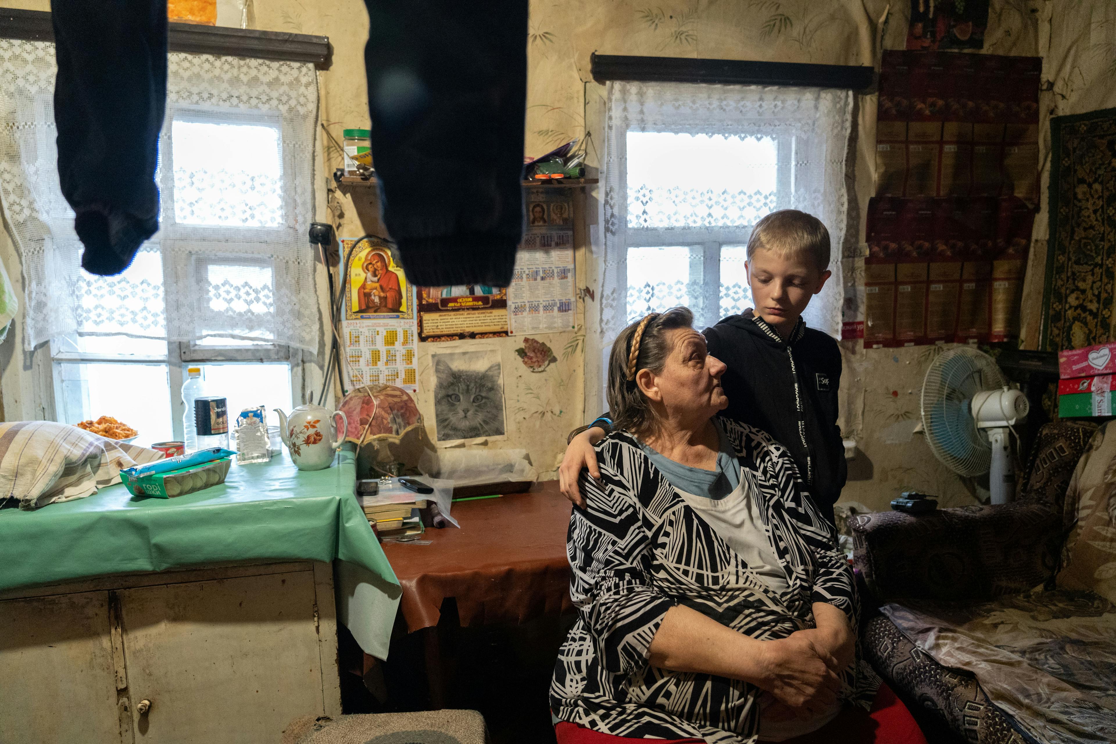 Ten-year-old Bohdan with his grandmother, Izyum, Ukraine.