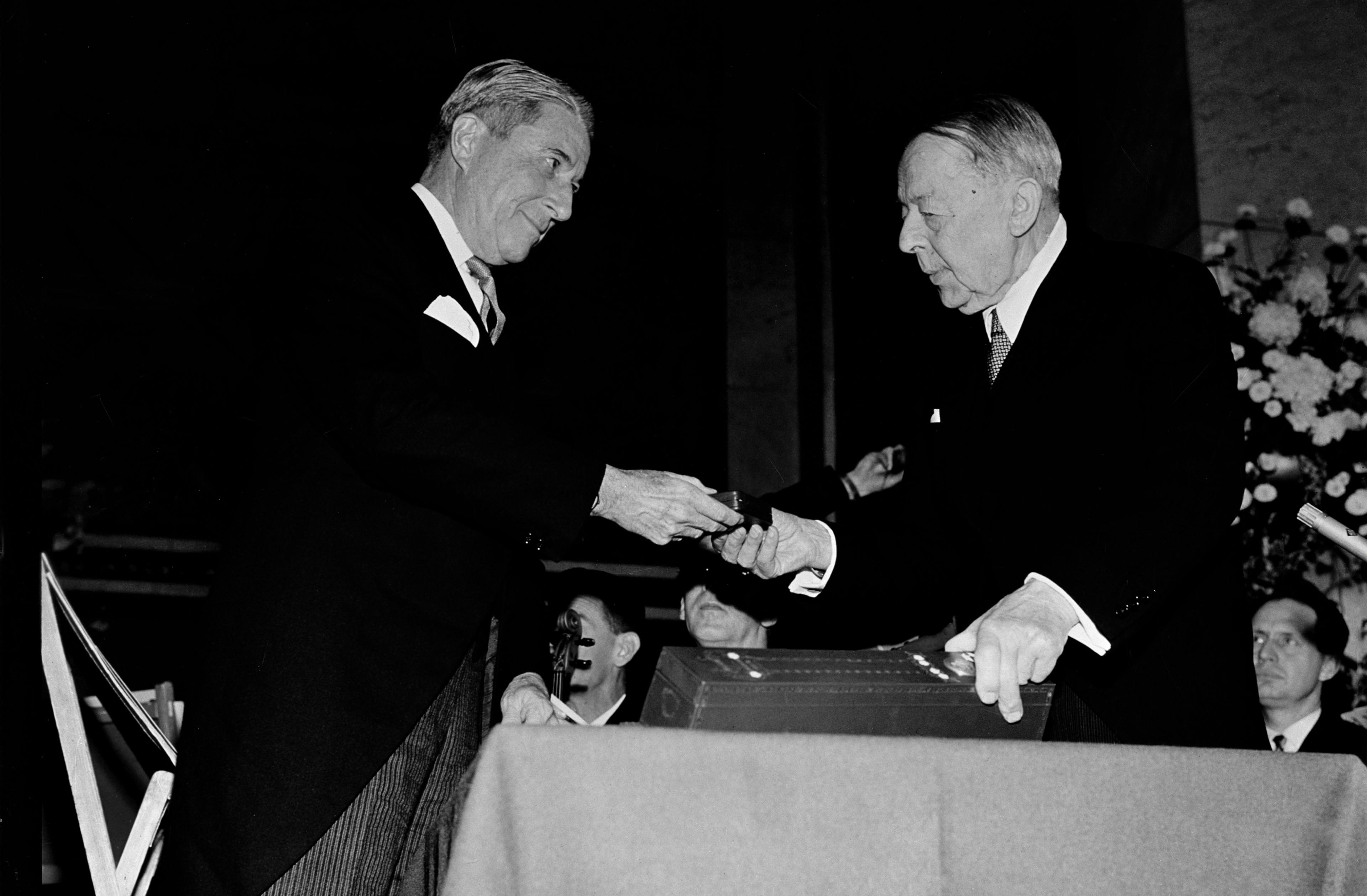 UNICEF Executive Director Henry Labouisse (left), receives the Nobel Peace prize medal on behalf of UNICEF, presented by Nobel Committee Chairman of the Norwegian Parliament, Gunnar Jahn, at the prize ceremonies at Oslo University in Oslo, the capital.