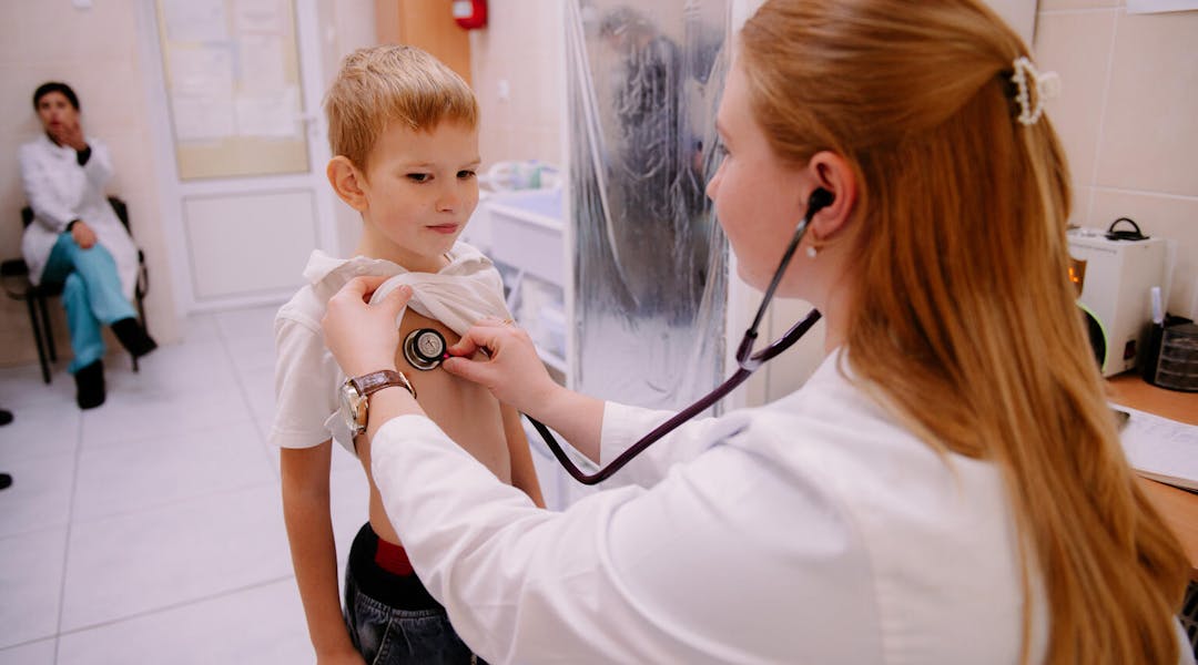 Ukraine Emergency, Doctor Kateryna Kushiova uses a stethoscope to examine 8-year-old Yaroslav Khorolets at a UNICEF supported Medical Centre in Kharkivska, Ukraine.