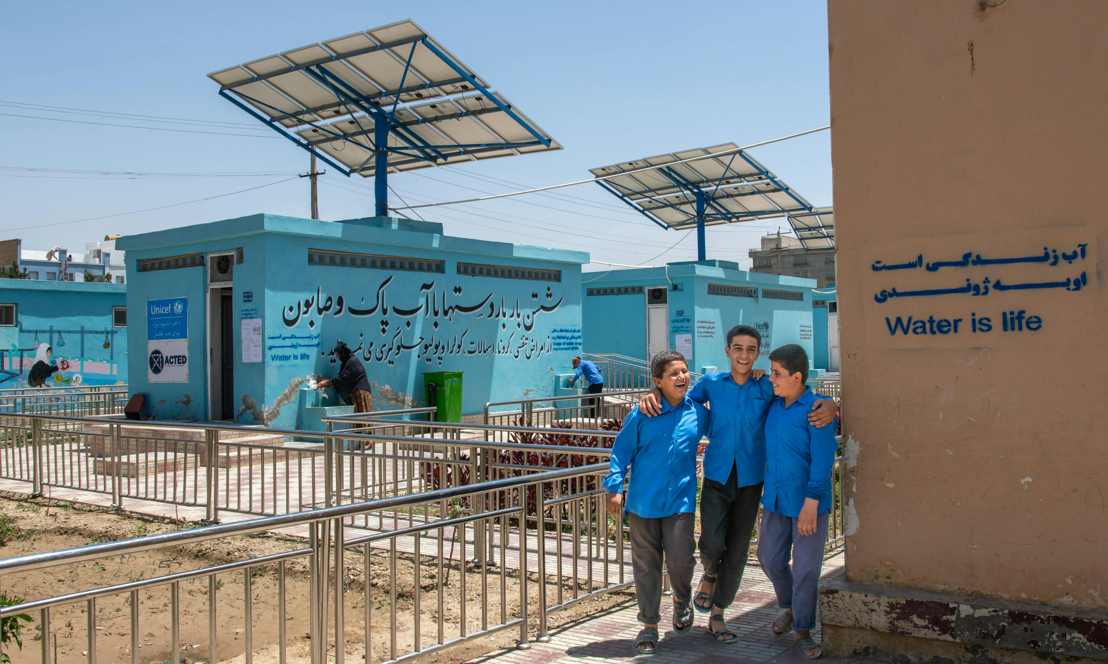 Global Parent- A group of students walk into the newly constructed latrines at Mawlana Jalaluddin Mohammad Balkhi School in Mazar-i-Sharīf, Balkh Province, Afghanistan