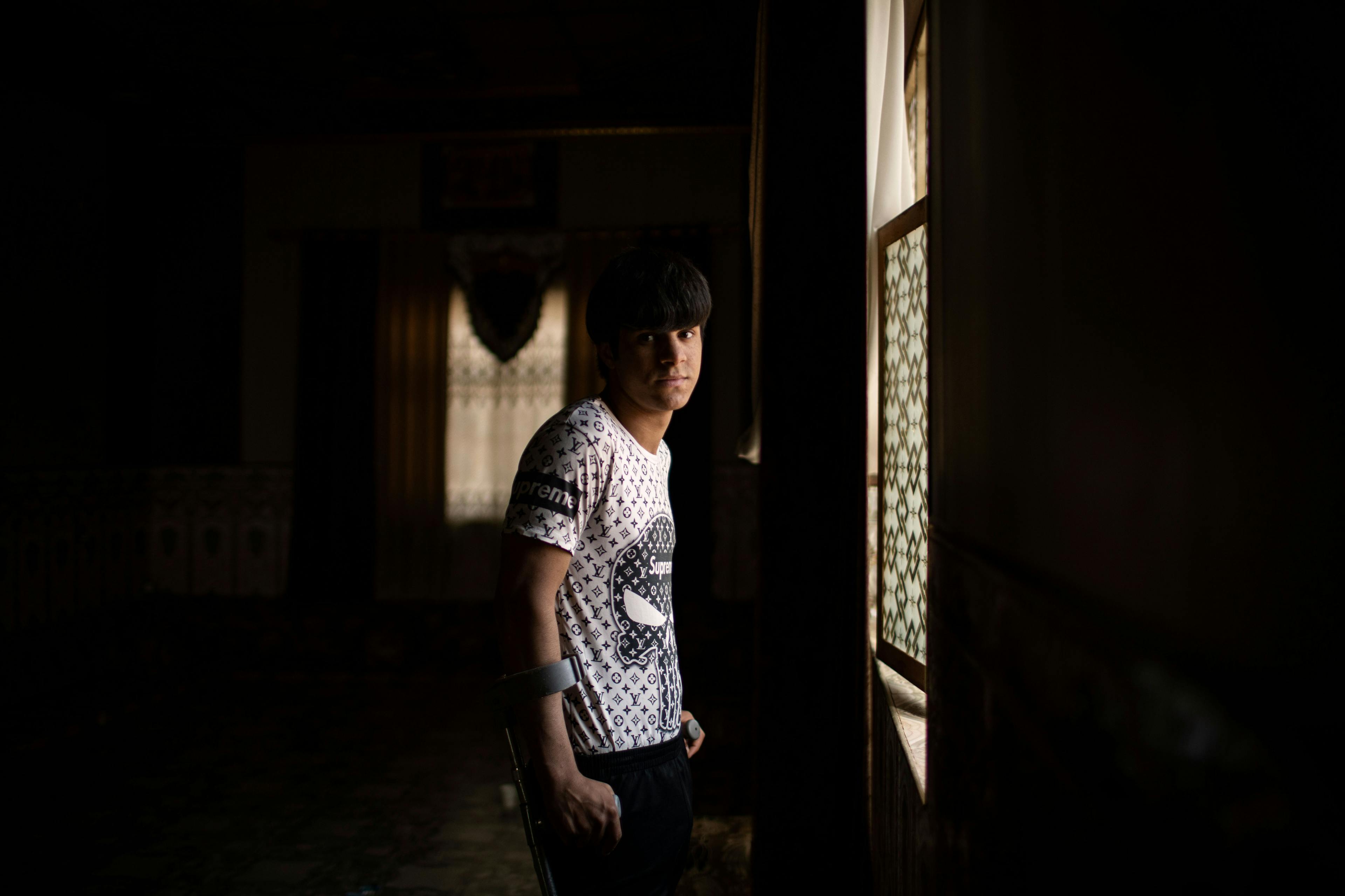 On 2 March 2022 in Iraq, a portrait of 18-year-old Muqtada made inside his home in Basra. When he was 16, he was injured by a landmine explosion close to the border with Iran and lost his right foot and part of his right leg. 
