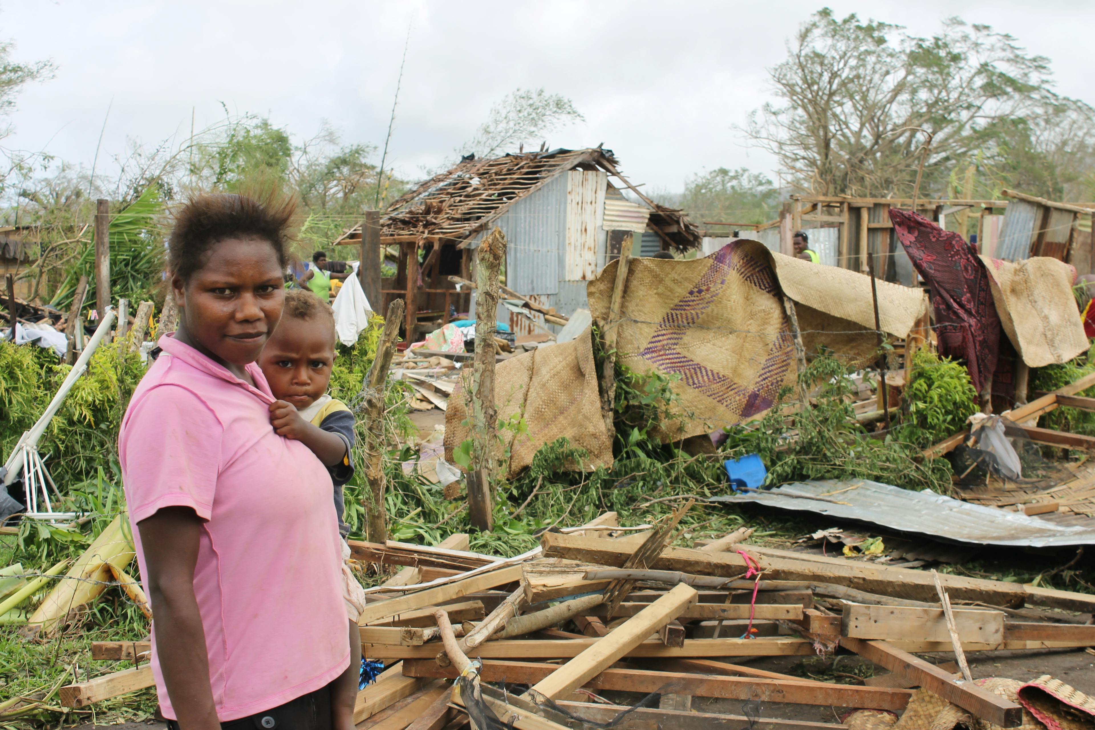 Marie and her son Ceriel (11 months) outside their home in Taunono village that was destroyed by Cyclone Pam

