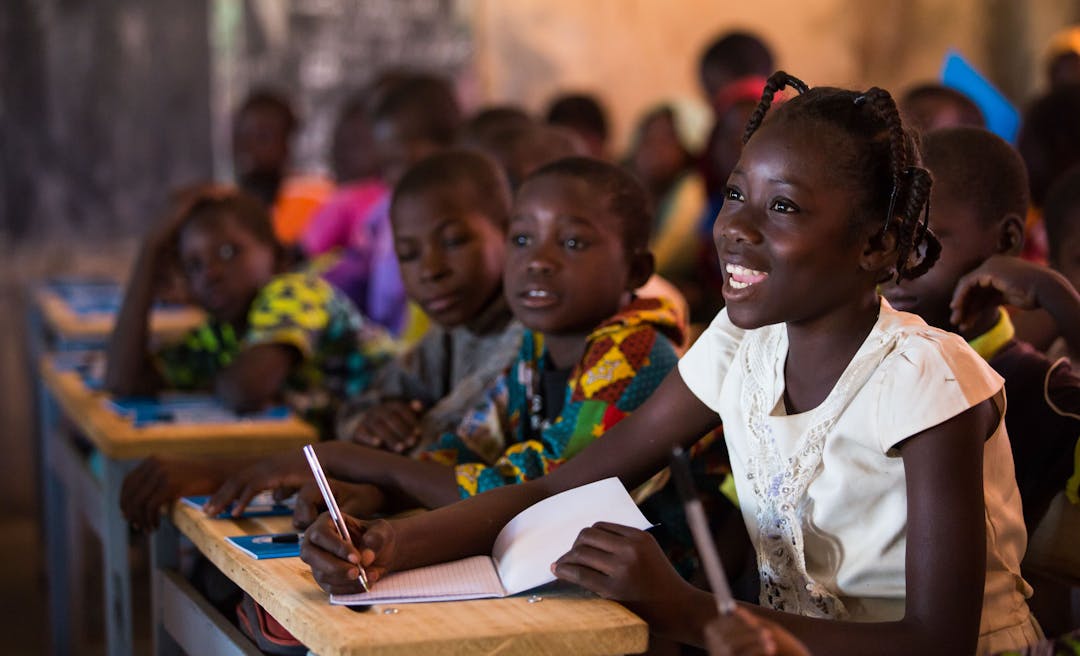 UNICEF Aotearoa- Nabyla (right), 13, attends class in Kaya, Burkina Faso, the town in which her family found refuge after being displaced.