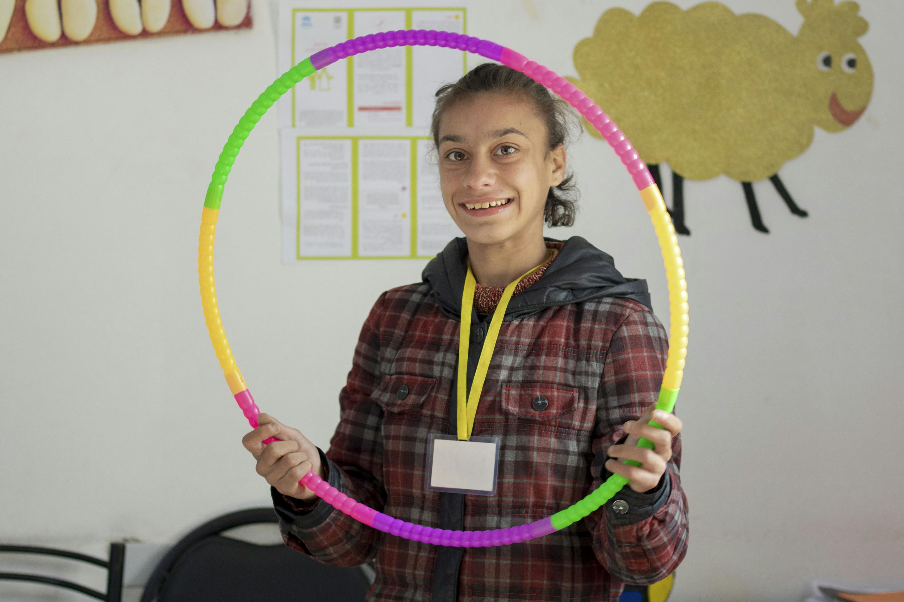 Fatima taking part in recreational activities at a UNICEF-supported multiservice centre in Aleppo city.