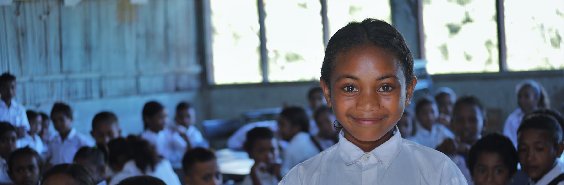 Children in Timor-Leste engaging in playful learning activities at a community-based early childhood education center, supported by UNICEF Aotearoa and The Ministry of Foreign Affairs and Trade (MFAT), fostering early education for school readiness.