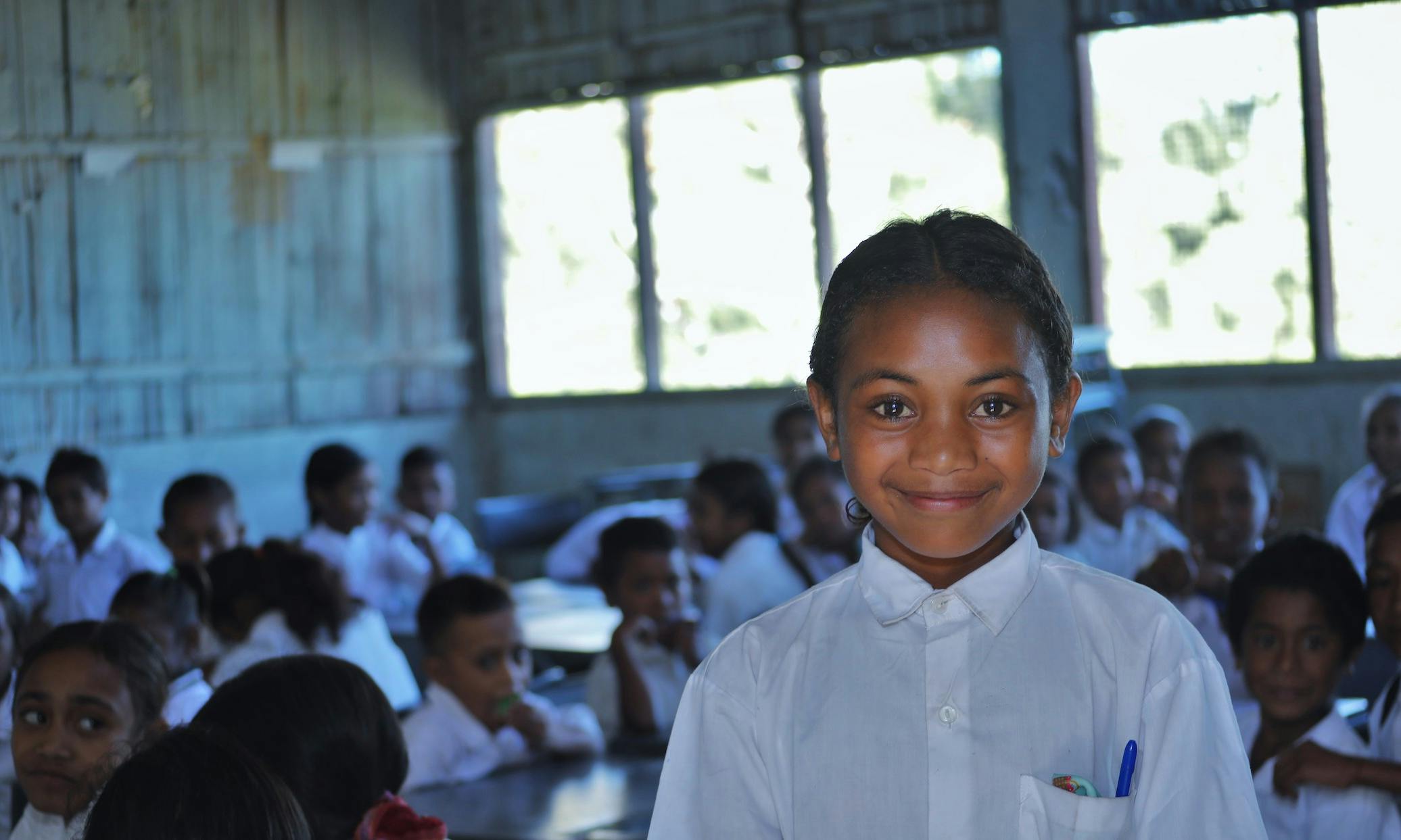 Children in Timor-Leste engaging in playful learning activities at a community-based early childhood education center, supported by UNICEF Aotearoa and The Ministry of Foreign Affairs and Trade (MFAT), fostering early education for school readiness.