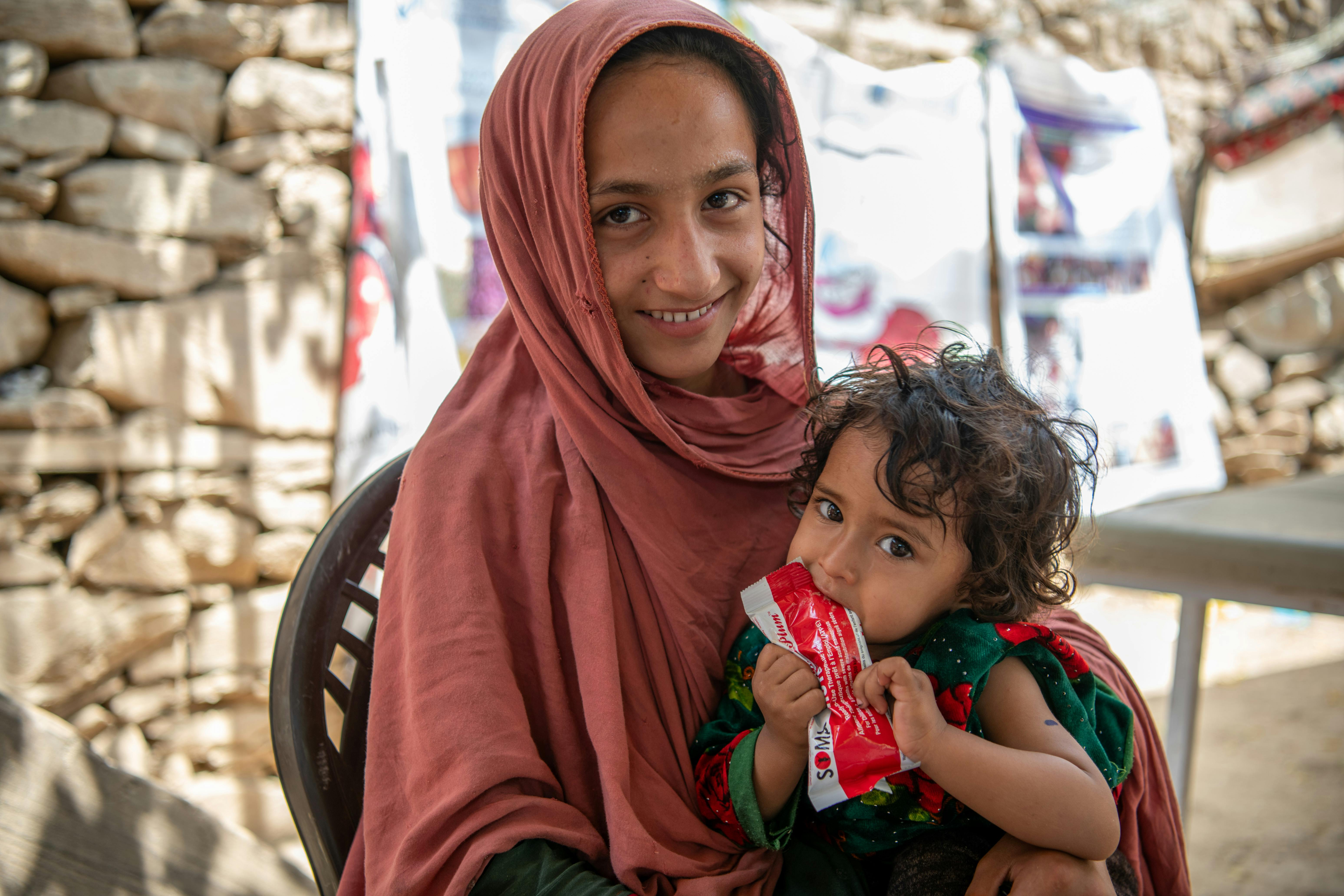 On June 25 2023, a child named Zarmina receives RUTF at UNICEF-supported mobile health and nutrition teams (MHNTs) in Samsagal village, Nari District, Kunar, Afghanistan.