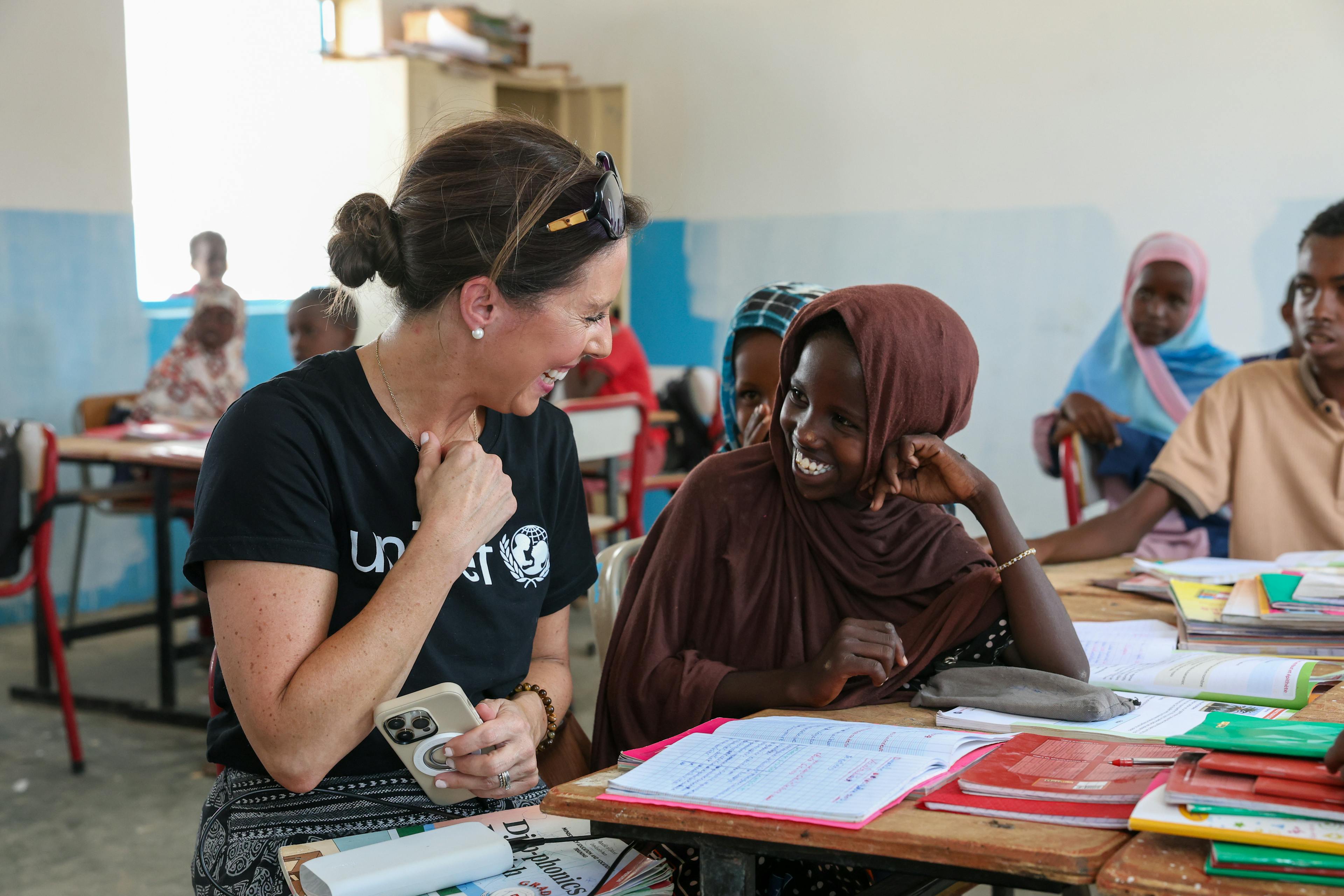 UNICEF Aotearoa's CEO, Michelle Sharp, talking to a young girl in the local school in the Dikhil region