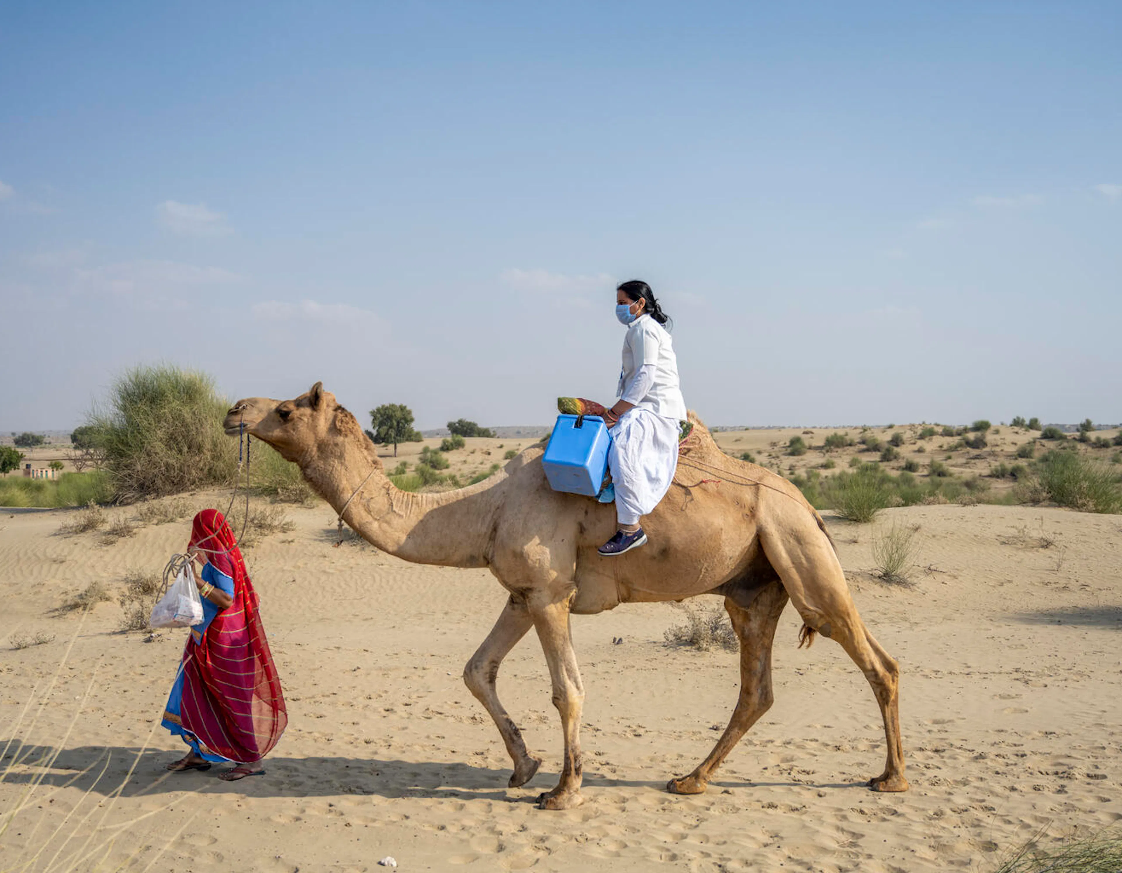 Immunisation - Riding camel-back through deserts to reach remote villages in India.