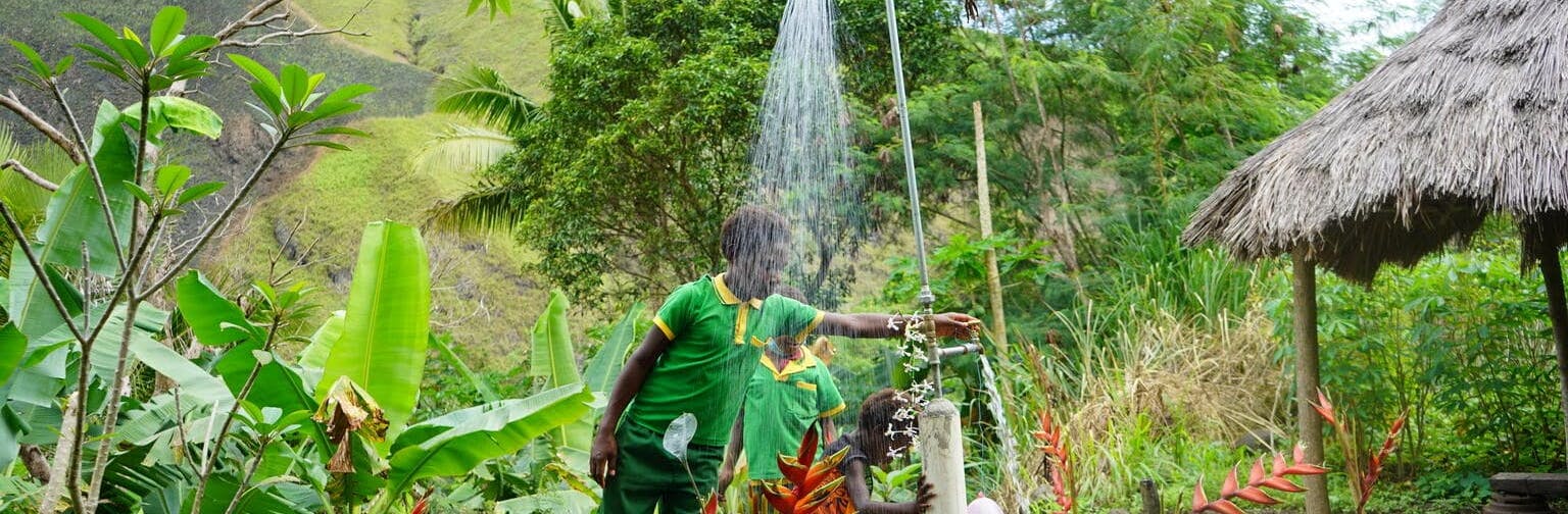 The installation of water point such as these (shower and tap), supported by the European Union and implemented by ADRA,  means that school children at Kasuka community in Nawaeb District, Morobe Province no longer have to go far for their water needs.