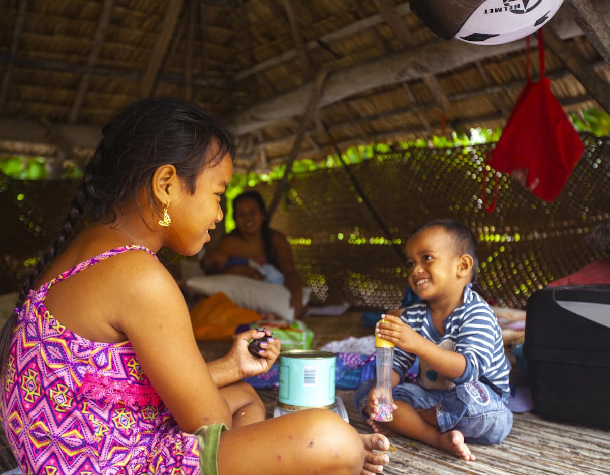Health & Medicine- Naibobou, four-years-old and Taumwaon, eight-years-old who play energetically together in their open air ‘maneaba’ home.