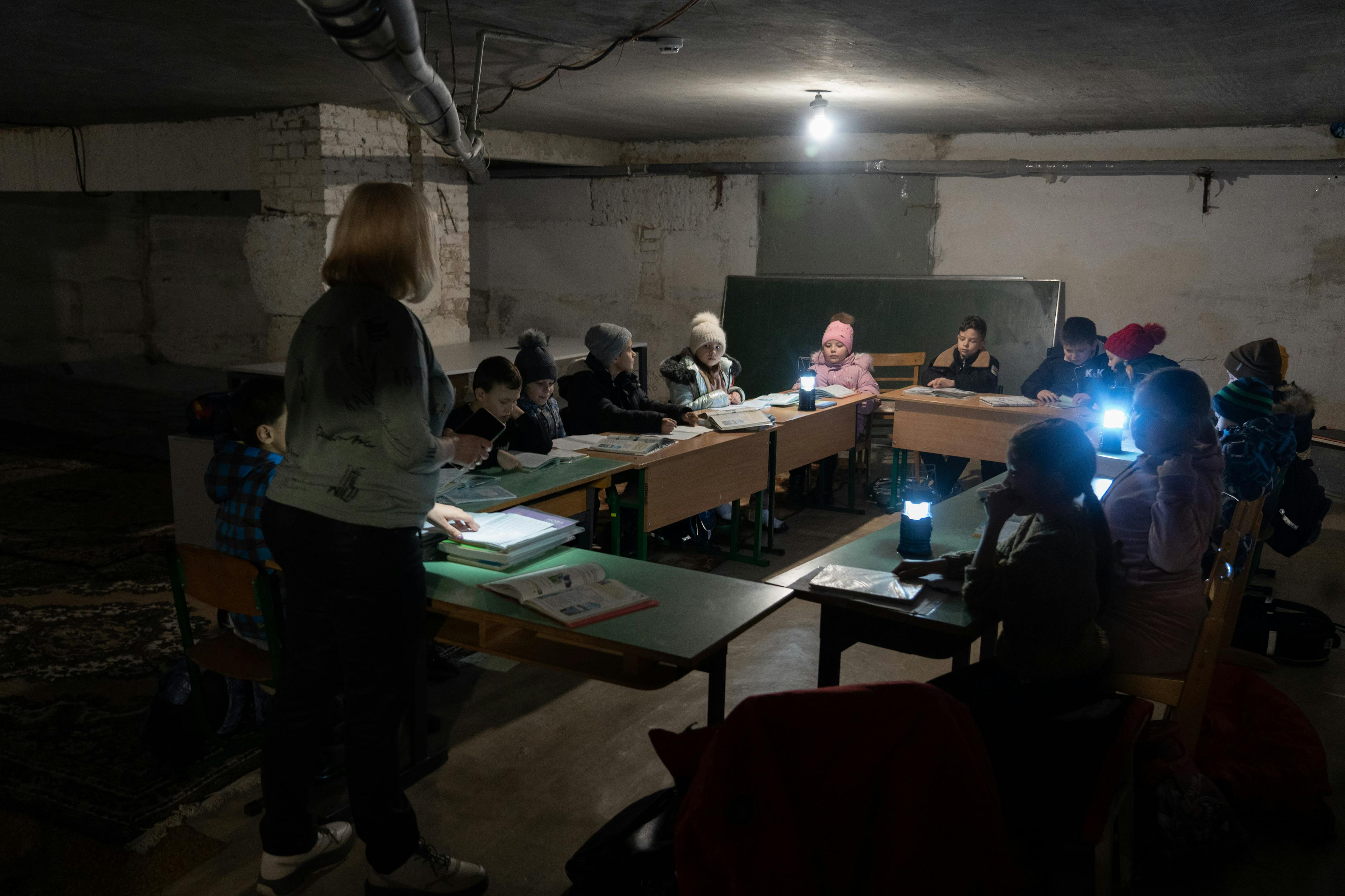 Children sheltering in the kindergarten boiler room.