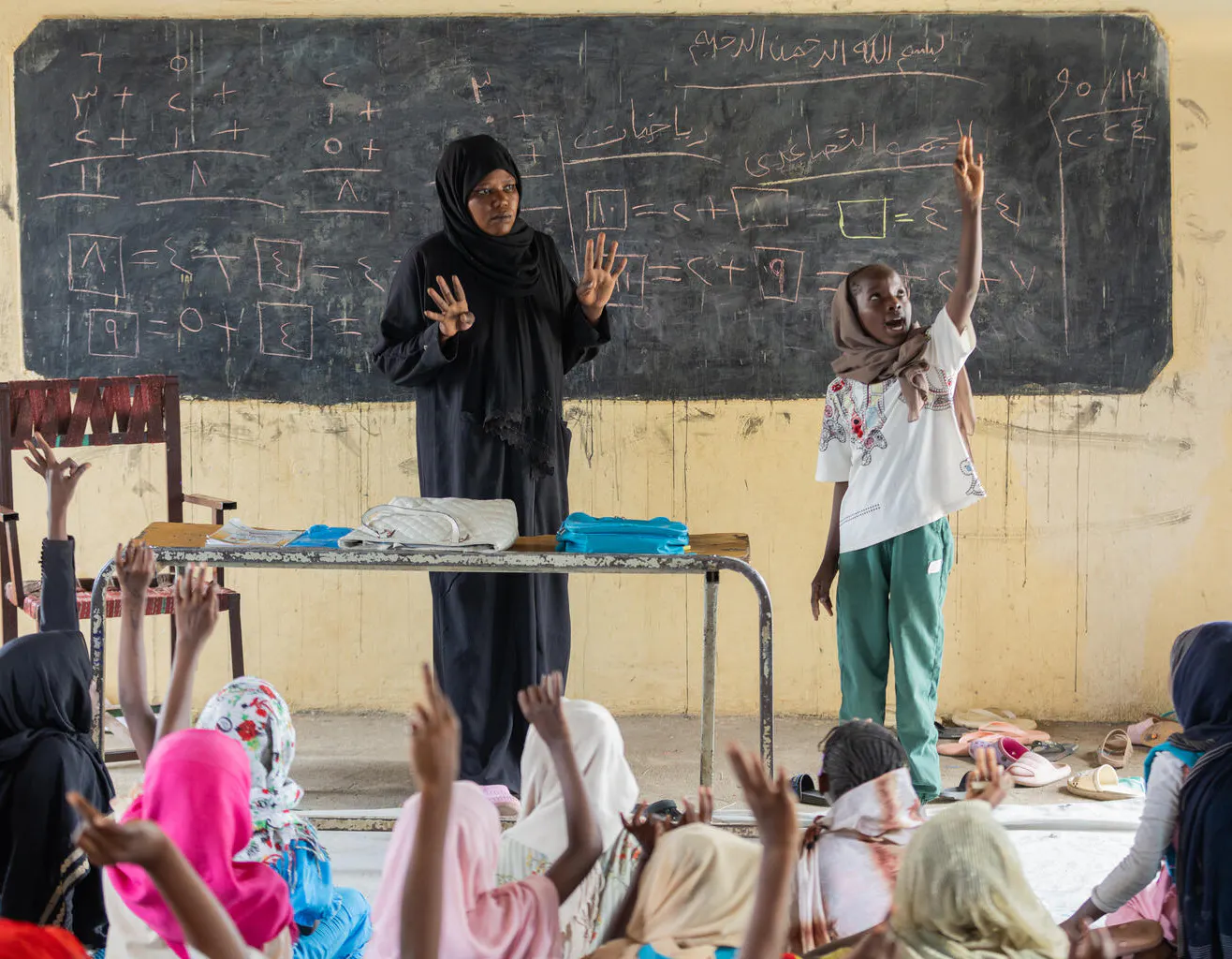 11-year-old Rabha stands at the front of the class, at the UNICEF-supported safe learning space in Gedaref, Sudan.
