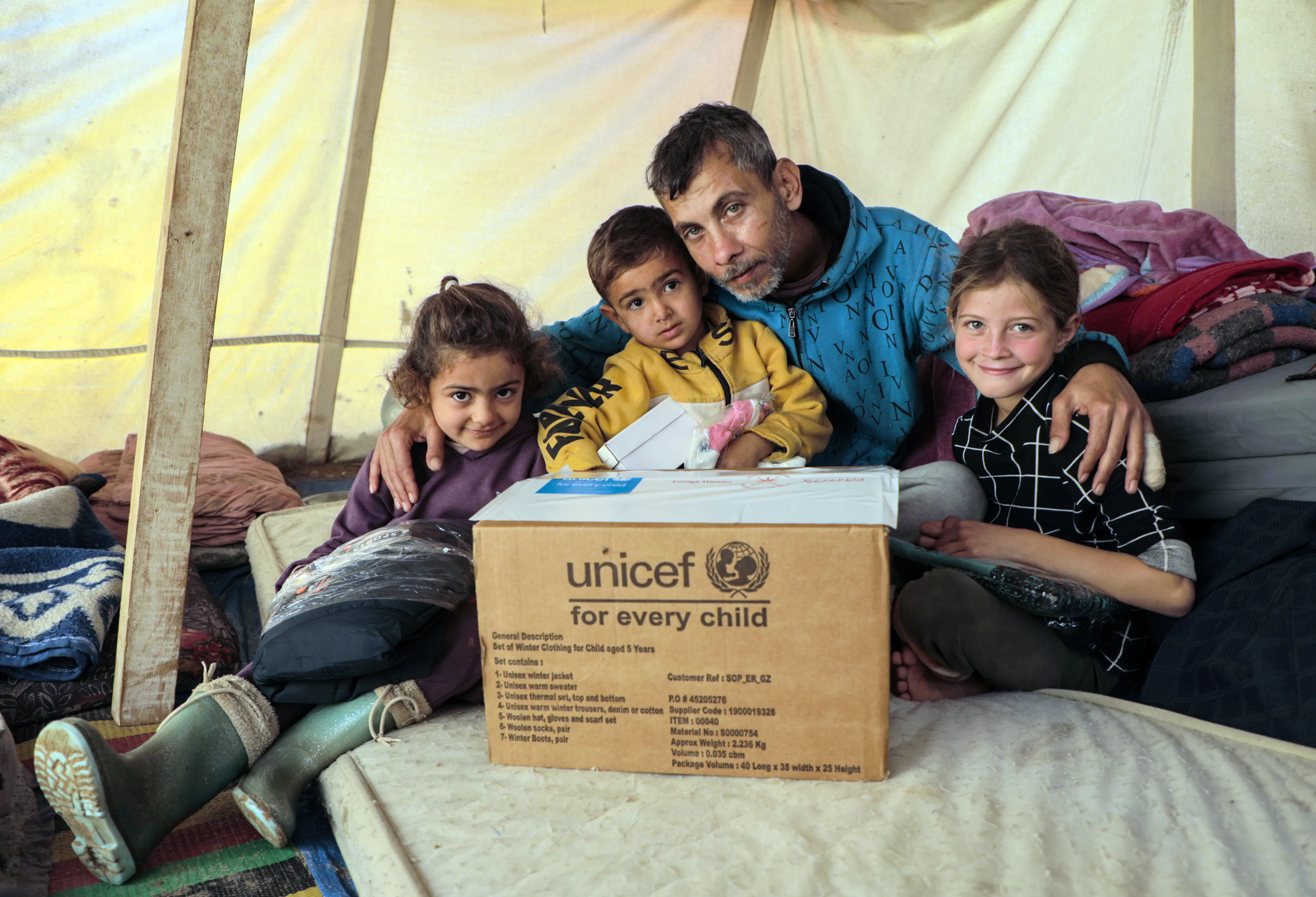 UNICEF and partners bring warmth to children in Khan Younis by distributing winter clothes to 7-year-olds in Algeria Camp and Al Amal Camp.